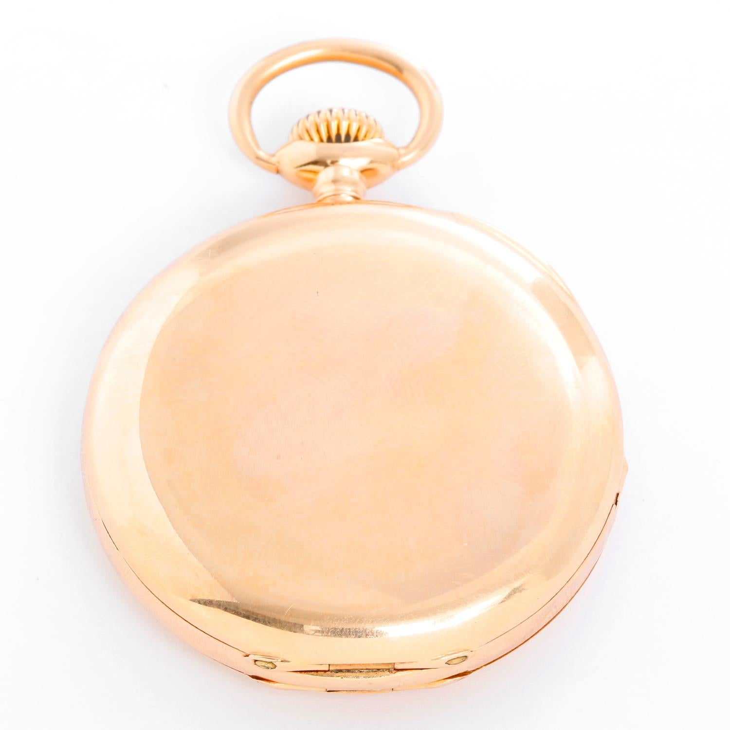 Patek Philippe 18K Yellow Gold Hinge Pocket Watch - Manual winding. 18K Yellow gold (47 mm) Case back insert engraved with makers mark and serial number . White dial with Roman numerals; subdial at 6 o'clock. Pre-owned with custom box.