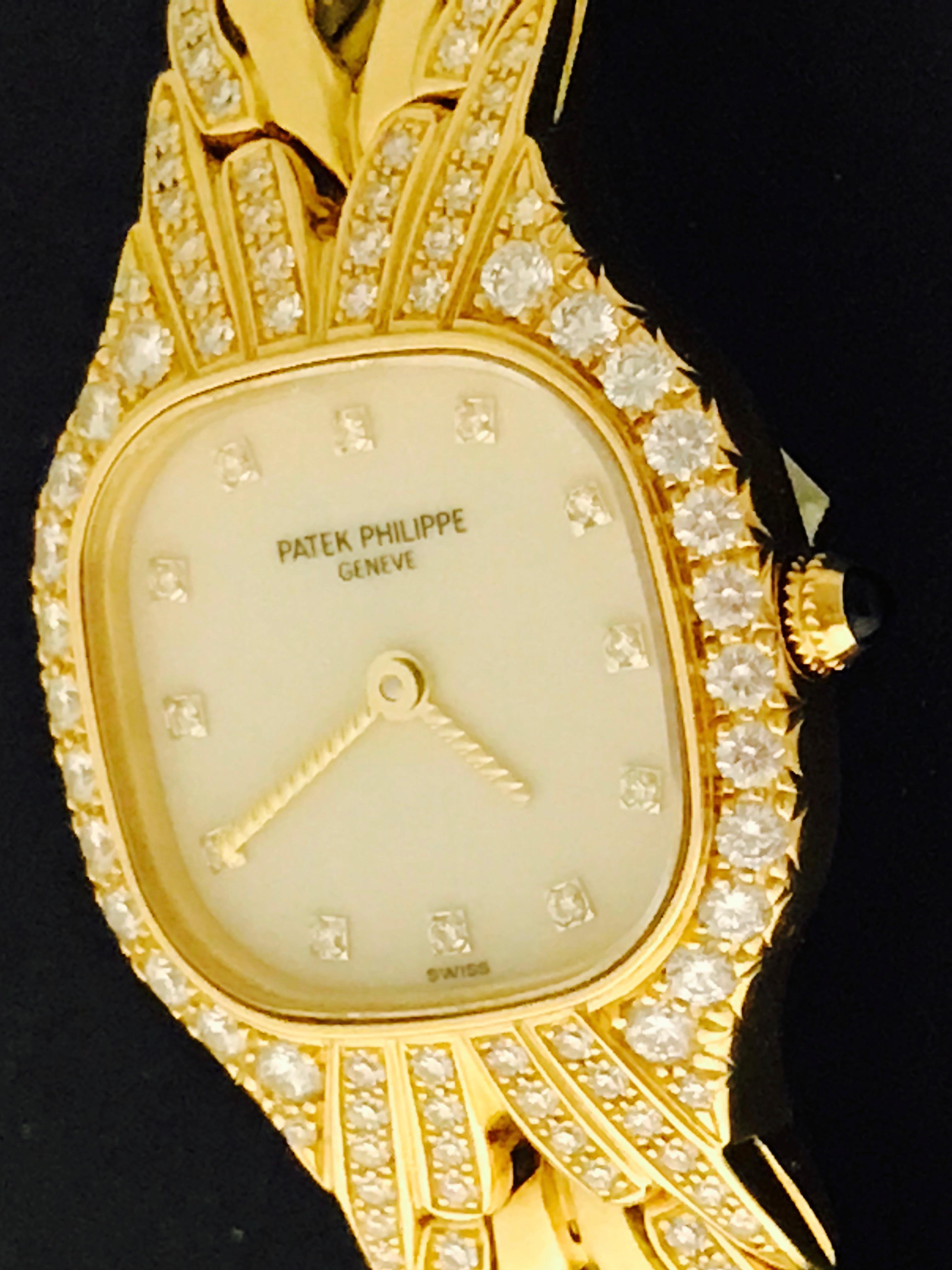 Patek Philippe La Flamme Ladies 4815/003 Quartz Wrist Watch in 18K Yellow Gold.  This timepiece features an 18k Yellow Gold Diamond case and lugs measuring 22x27mm.  Ivory Dial with Diamond hour markers. 18k Yellow Gold and partial diamond Patek