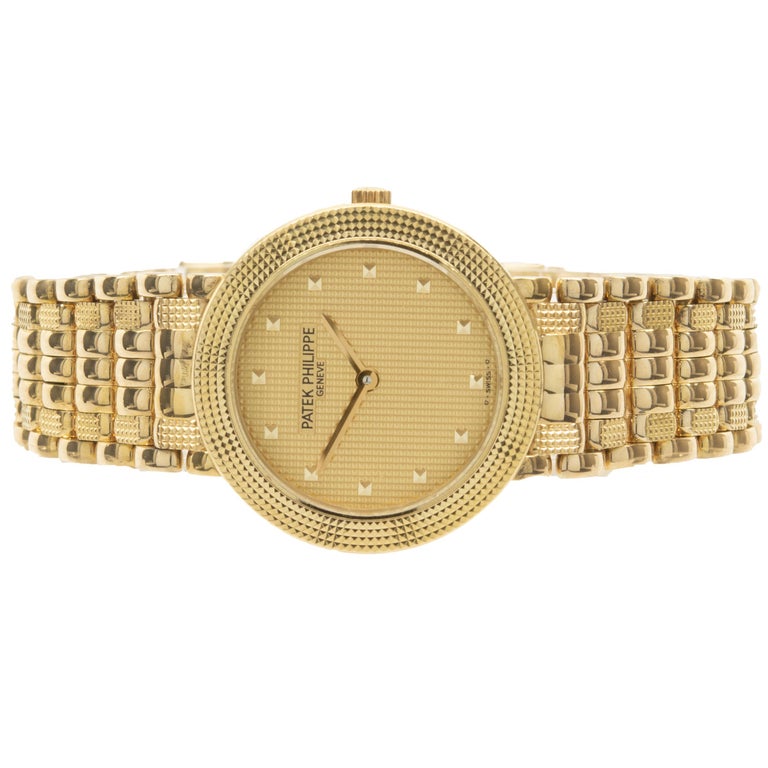 Movement: quartz
Function: hours, minutes
Case: 25mm 18K yellow gold case, hobnail bezel, sapphire crystal, push pull crown
Band: 18K yellow gold hobnail link bracelet,  fold over clasp
Dial: champagne hobnail dial
Reference: 4919/8
Serial: