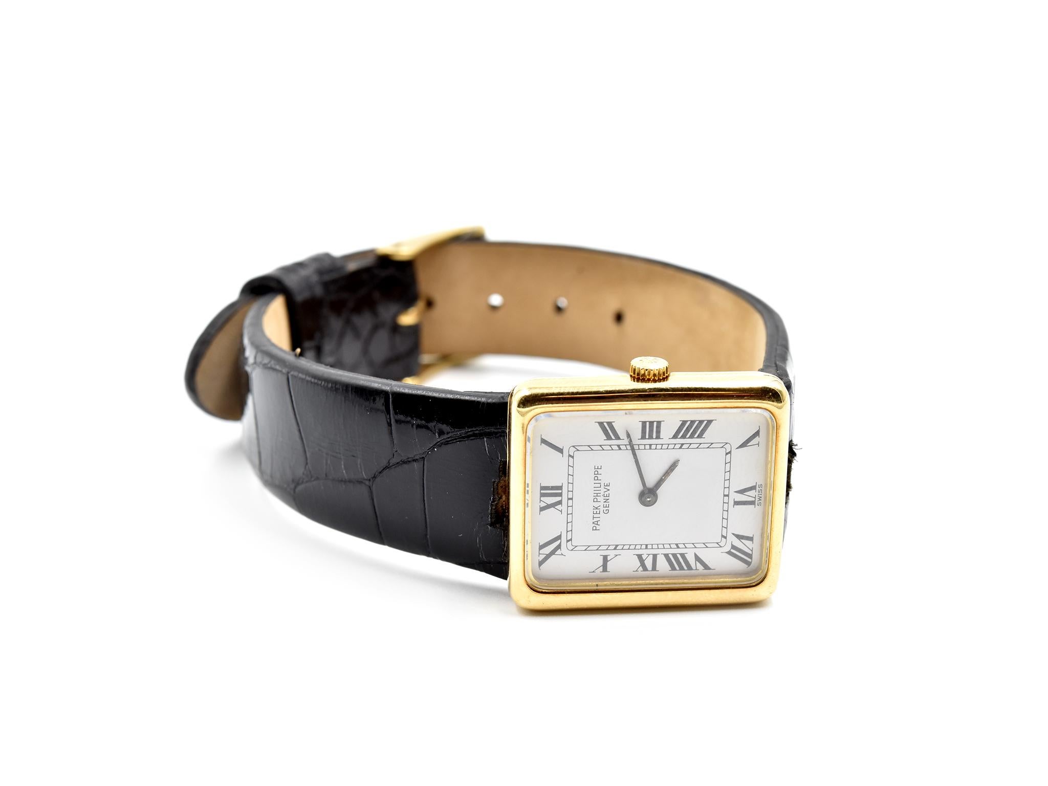 Movement: manual wind
Function: hours, minutes
Case: rectangular 25.00mm x 22.00mm 18k yellow gold case with fixed bezel, sapphire crystal, winding crown, solid case
Dial: white roman numeral dial with black hands, black indexes
Serial #: