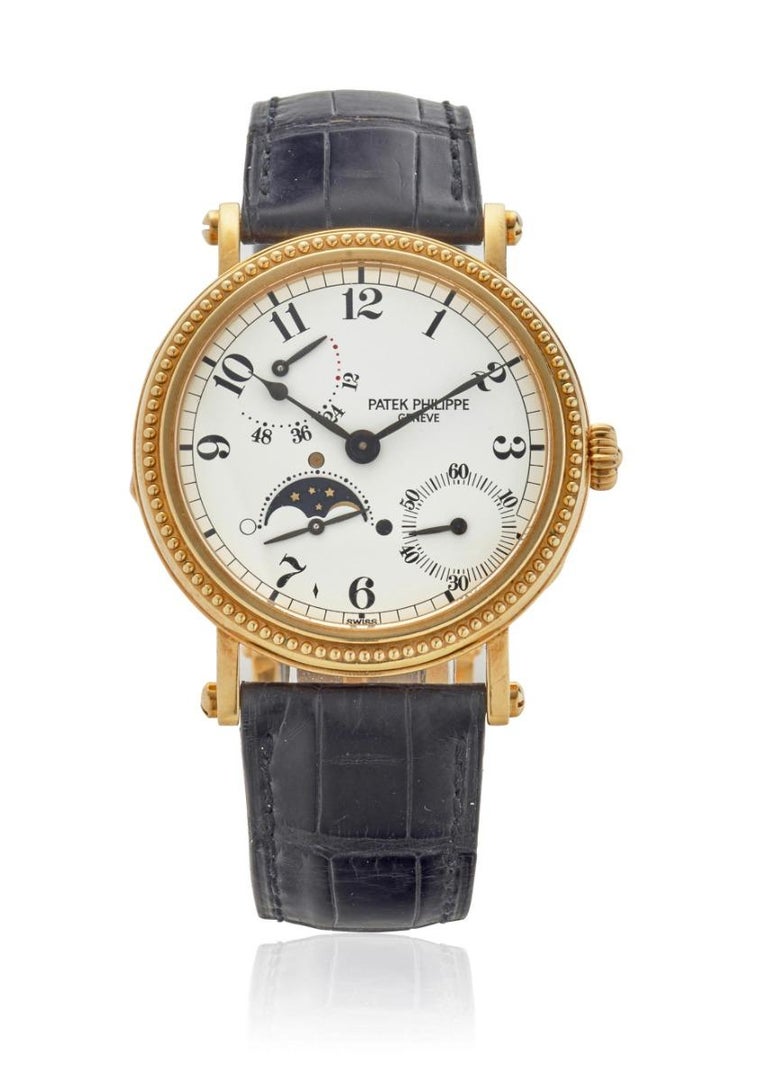 PATEK PHILIPPE. AN 18K GOLD AUTOMATIC WRISTWATCH WITH MOON PHASE AND POWER RESERVE
Reference: 5015J-001
Date: Purchased 24th November, 1998
Movement: 29-jewel Cal.240/154 automatic, adjusted to heat, cold, isochronism and 5 positions, 22k gold micro