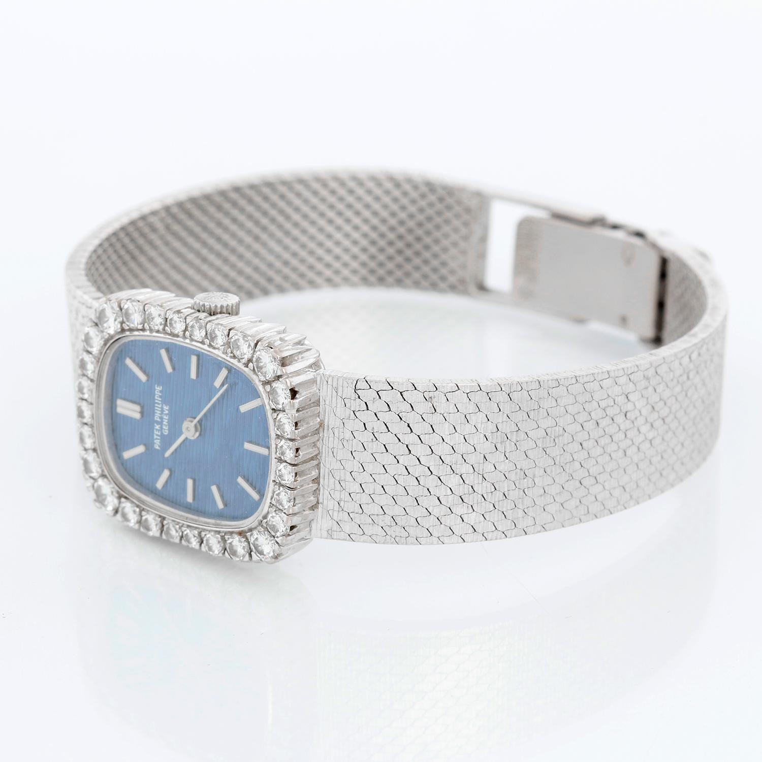 Patek Philippe 18k White Gold  Ellipse Men's Watch Ref. 4102 - Manual. 18k white gold case (18mm x 22mm). Textured blue dial . Patek Philippe & Co. 18K white gold bracelet; will fit a 6 inch wrist . Pre-owned with Patek Philippe  box.