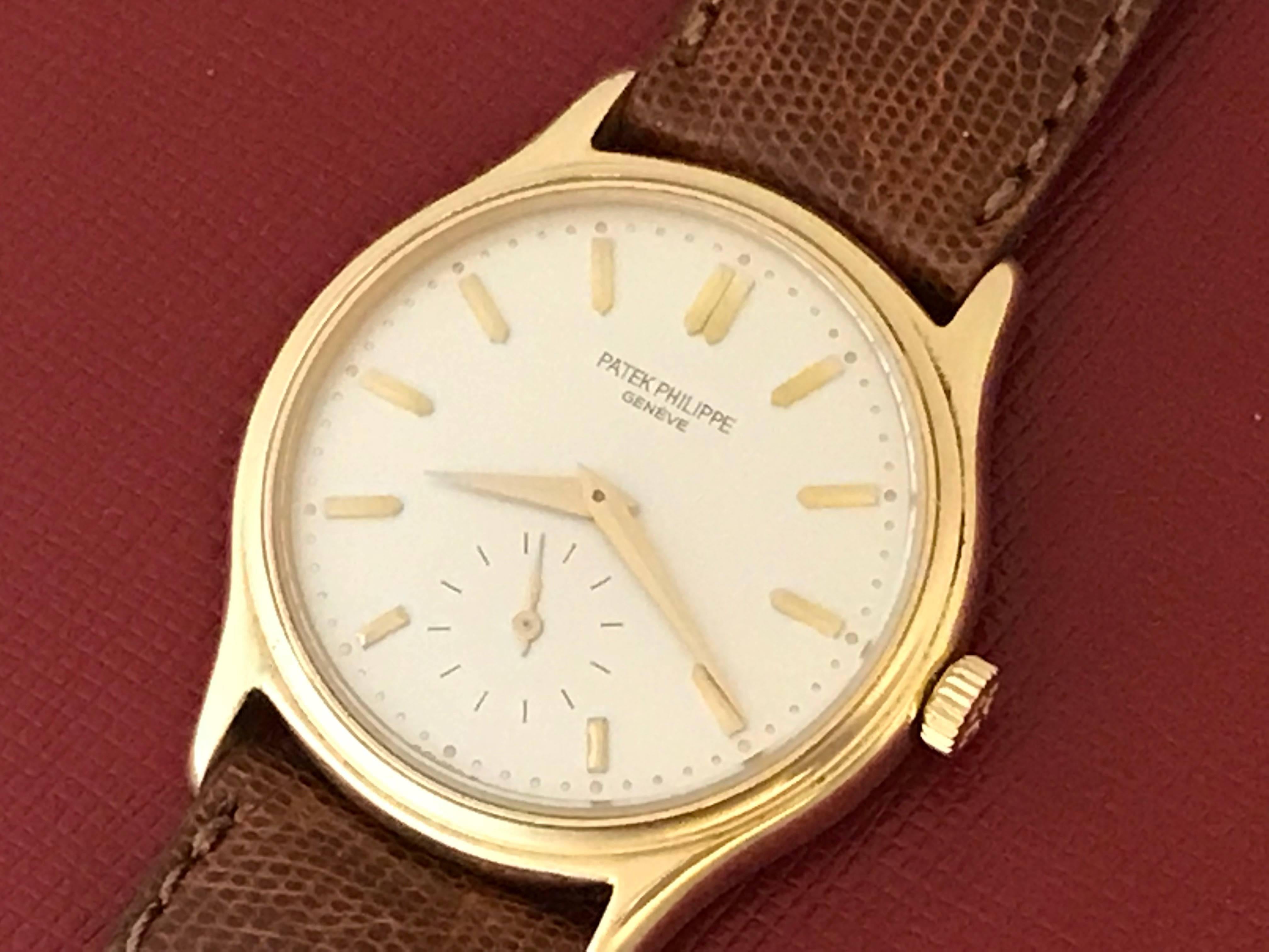 Patek Philippe Model 3923 Mens Wrist Watch. 18k Yellow Gold round case measuring 32mm diameter. Strap with yellow gold filled buckle. Silvered Dial with yellow gold hour markers. Certified pre-owned and ready to ship.  Inventory # C47522.