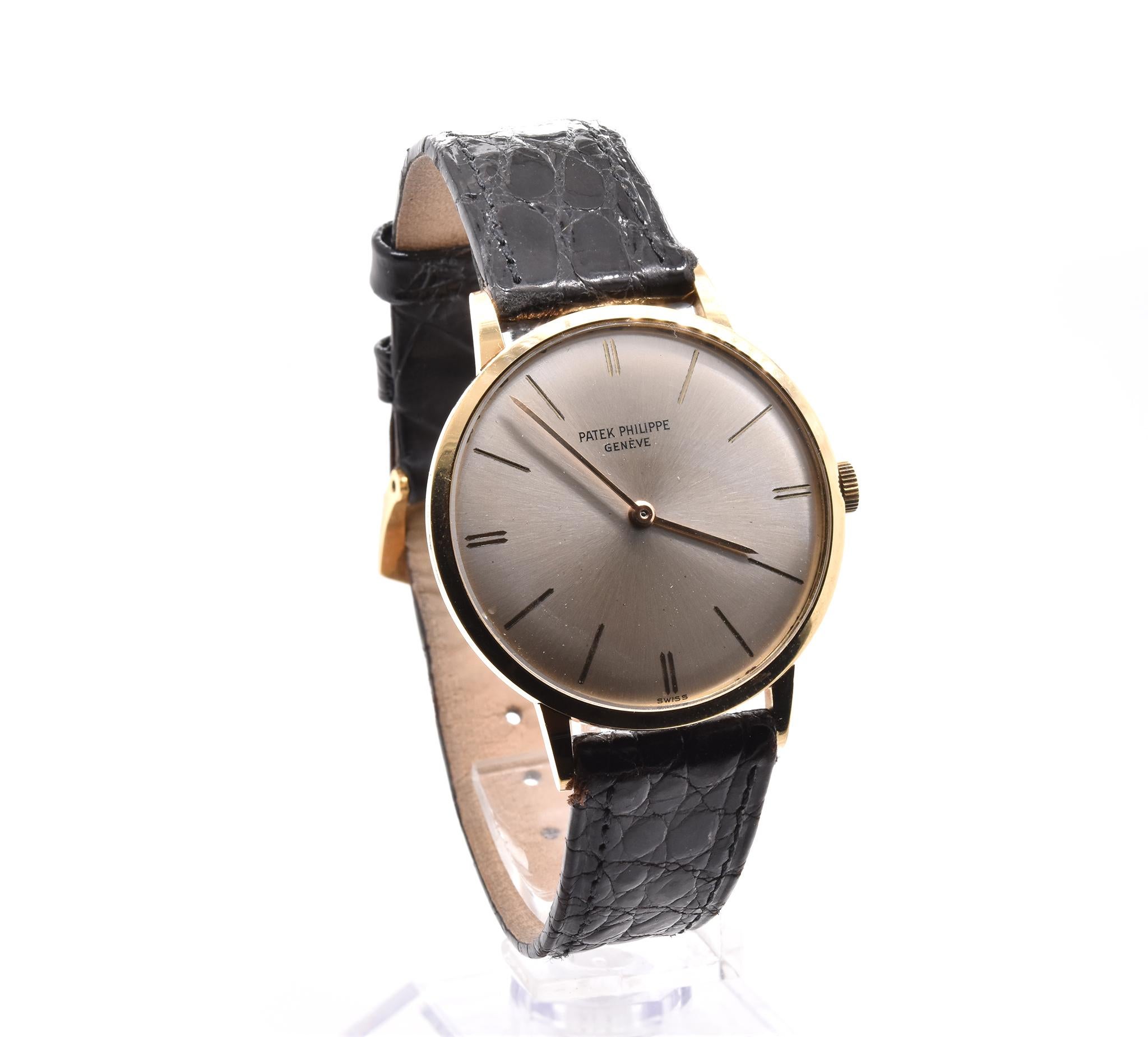 Movement: automatic
Function: hours, minutes, 
Case: 33mm yellow gold case, sapphire protective crystal, push/pull crown
Dial: silver dial with yellow gold hands and stick hour markers
Band: black crocodile strap with factory 18K yellow gold patek