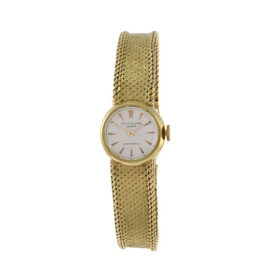 This is a Patek Philippe 18K gold cocktail watch exclusively sold By Albonico Biella through an exclusive relationship with Patek Philippe. This watch has a two body construction with polished, flat top crystal. The bezel is round  and the dial is