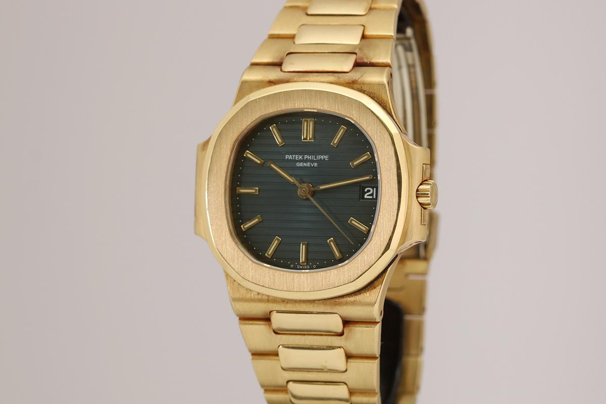 This is a Patek Philippe Nautilus reference 3800 in 18K Yellow Gold. It features the blue dial in beautiful condition and an untouched case and bracelet. The Nautilus is always an iconic design by Gerald Genta for Patek Philippe. Comes with an