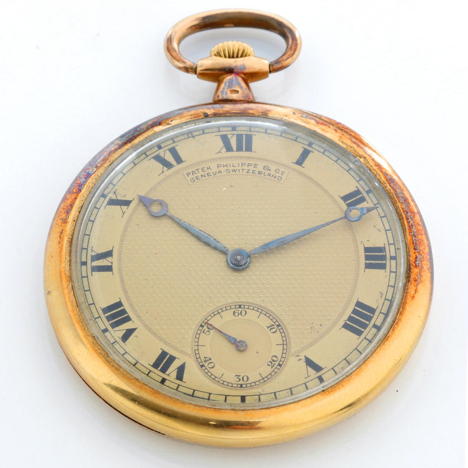 Patek Philippe 18K Yellow Gold Open Face Pocket Watch - Manual winding; 18 jewels . 18K Yellow gold (44 mm) . Gold dial with black roman numerals . Pre-owned with custom box .