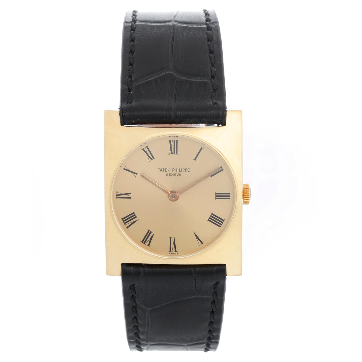Patek Philippe 18K Yellow Gold Rectangular Watch Ref 3557 - Manual winding . 18K Yellow Gold square style case ( 28 x 35 mm) . Champagne dial with black roman numerals. Black alligator strap with yellow gold filled buckle . Pre-owned with custom box