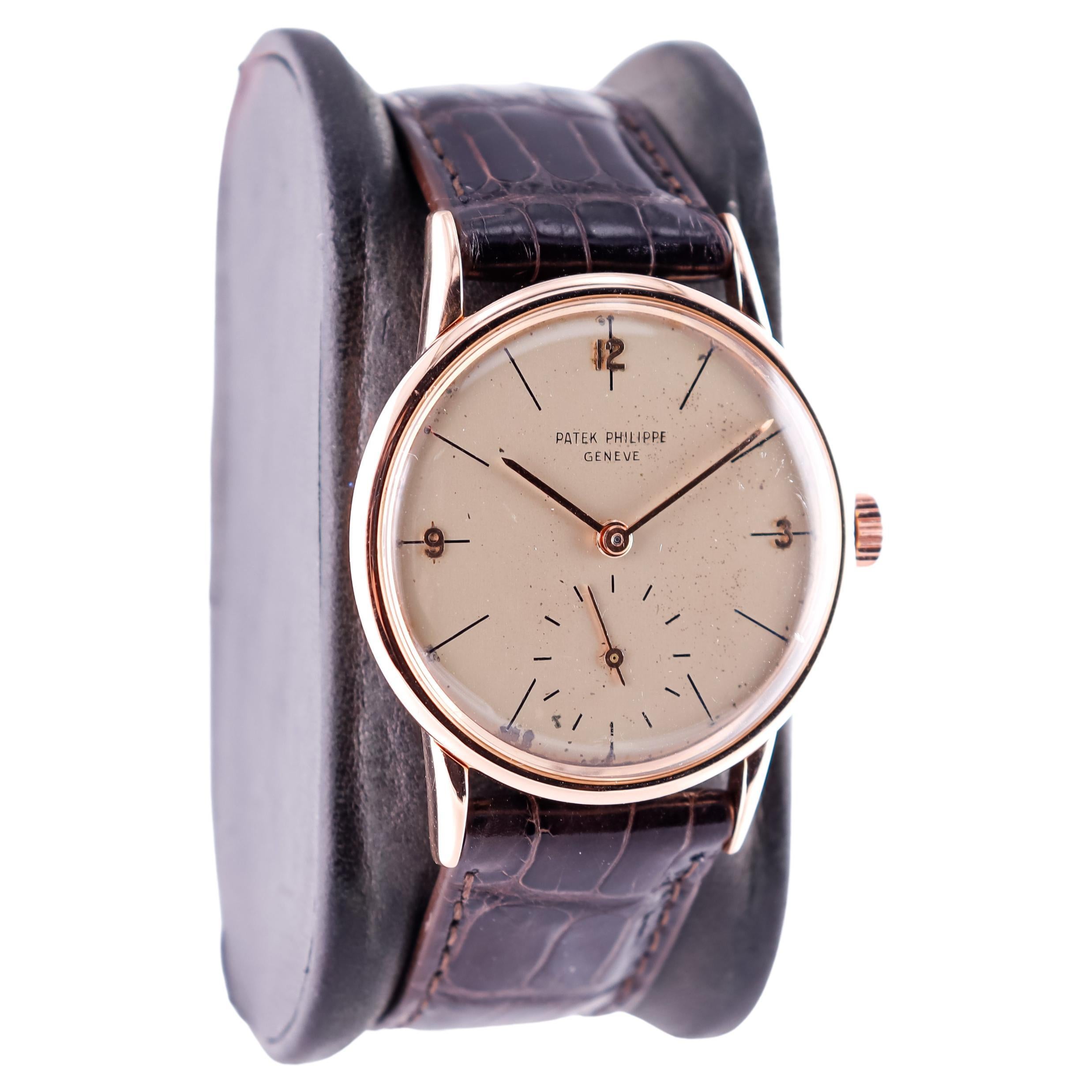 FACTORY / HOUSE: Patek Philippe et Cie.
STYLE / REFERENCE: Round Art Deco  / Reference 2494
METAL / MATERIAL: 18kt Rose Gold 
CIRCA / YEAR: 1940's
DIMENSIONS / SIZE: 41 Length X 33 Diameter
MOVEMENT / CALIBER:  Manual Winding / 18 Jewels 
DIAL /