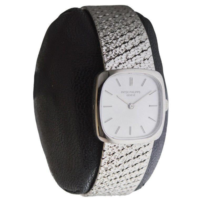 FACTORY / HOUSE: Patek Philippe
STYLE / REFERENCE: Dress Style / Reference 4179-1
METAL / MATERIAL: 18Kt Solid White Gold
CIRCA / YEAR: 1970's
DIMENSIONS / SIZE: Length 20mm X Width 20mm
MOVEMENT / CALIBER: Manual Winding / 17 Jewels / High