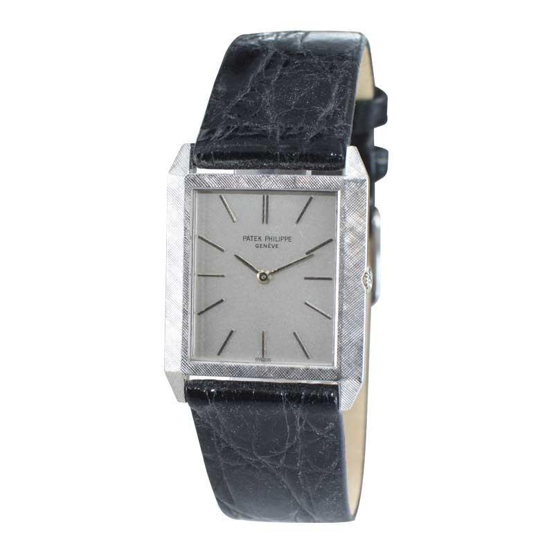 FACTORY / HOUSE: Patek Philippe & Cie.
STYLE / REFERENCE: Dress Model Tank Style / Ref. 3491
METAL / MATERIAL: 18kt White Gold
CIRCA / YEAR: 1960's
DIMENSIONS / SIZE: 34mm x 26mm
MOVEMENT / CALIBER: Manual Winding / 18 Jewels / Cal. 175
DIAL /