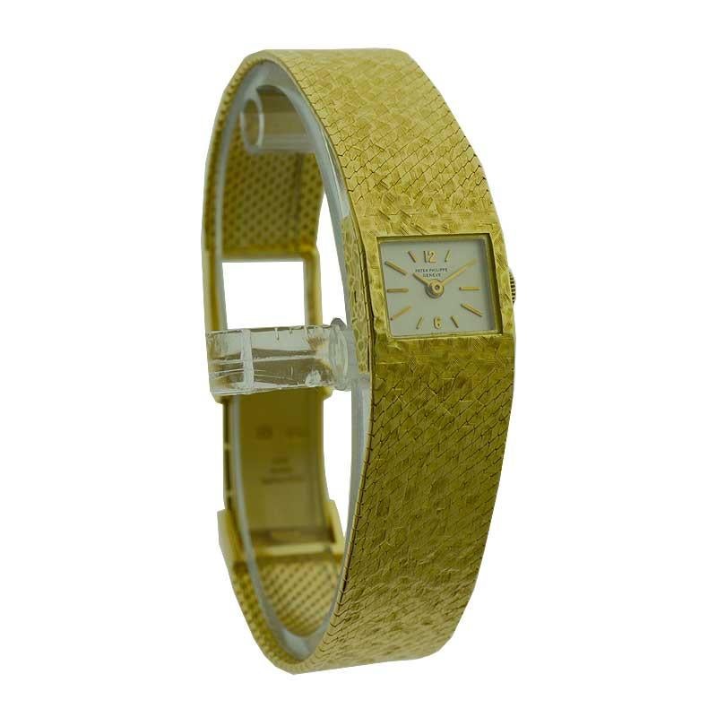 FACTORY / HOUSE: Patek Philippe et Cie.
STYLE / REFERENCE: Ladies Dress Watch / 3319-2
METAL / MATERIAL: 18kt Yellow Gold
CIRCA / YEAR: 1970's
DIMENSIONS / SIZE: 16mm X 14mm
MOVEMENT / CALIBER: Manual Winding / 18 Jewels 
DIAL / HANDS: Original