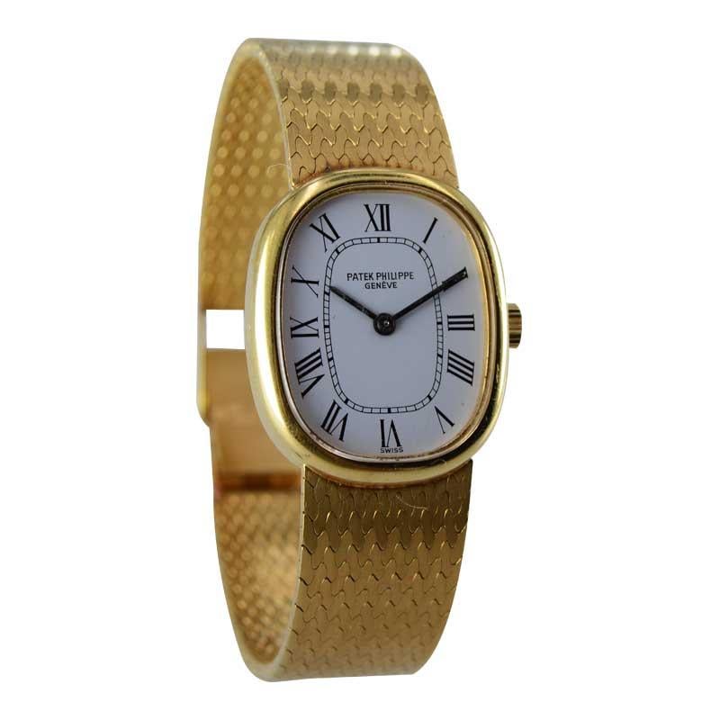 FACTORY / HOUSE: Patek Philippe & Co.
STYLE / REFERENCE: Ladies Dress Style Bracelet Watch
METAL / MATERIAL: 18kt Yellow Gold
CIRCA / YEAR: 1970's
DIMENSIONS / SIZE: 24mm x 20mm
MOVEMENT / CALIBER: Manual Winding / 18 Jewels 
DIAL / HANDS: Original