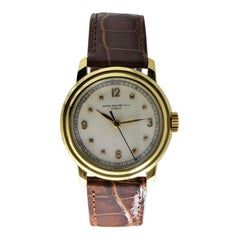Patek Philippe 18 Karat Gold Watch with a Custom Case and Archival Document