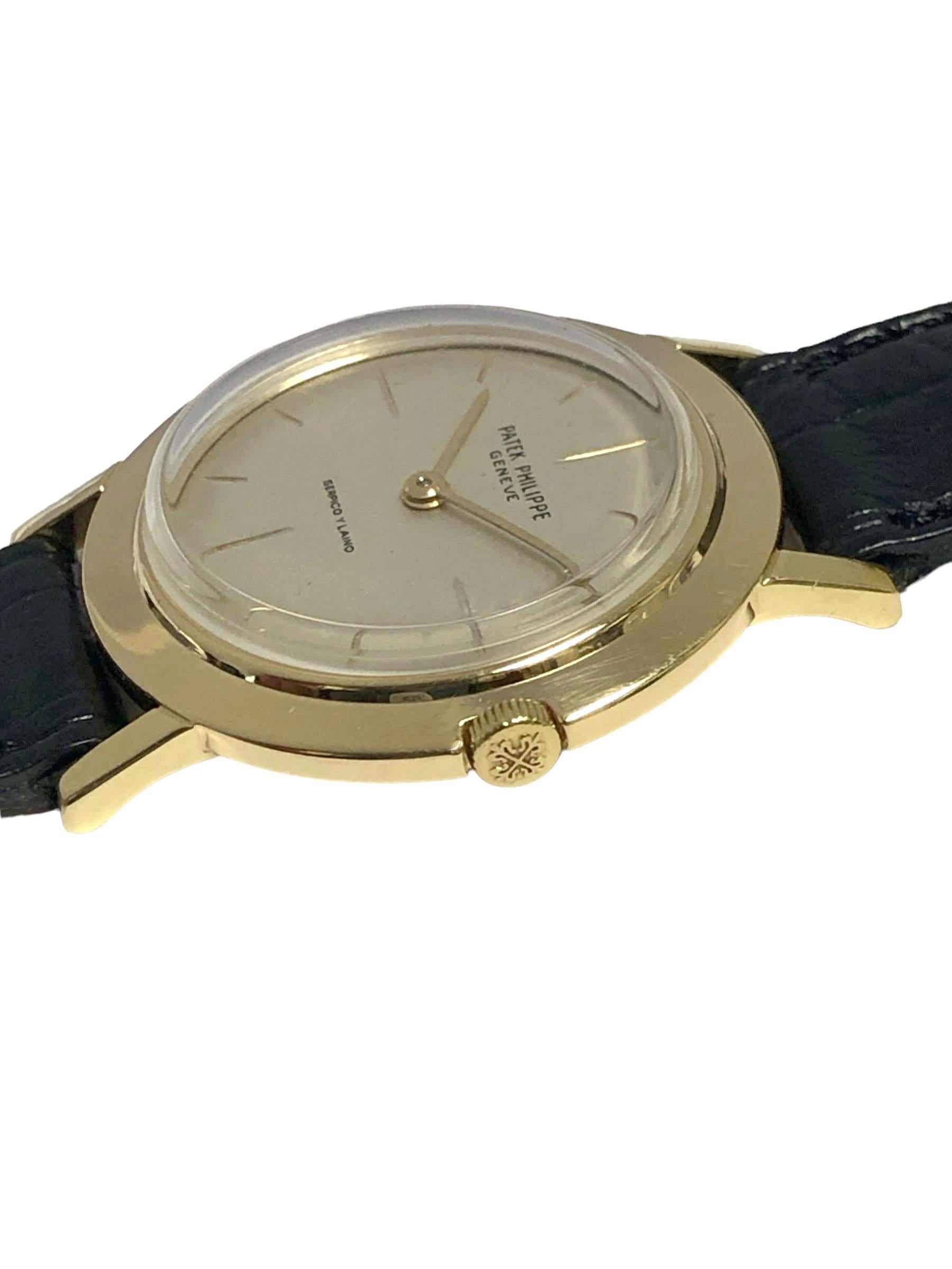 Circa 1960 Patek Philippe Reference 2595 Calatrava Wrist Watch, 32 M.M. 18k Yellow Gold 2 piece case, Patek logo Crown. Mechanical, Manual wind 18 Jewel, Caliber 23-300 Movement. Silver Satin Dial with Bright Gold Printed Markers. Serpico Y Laino