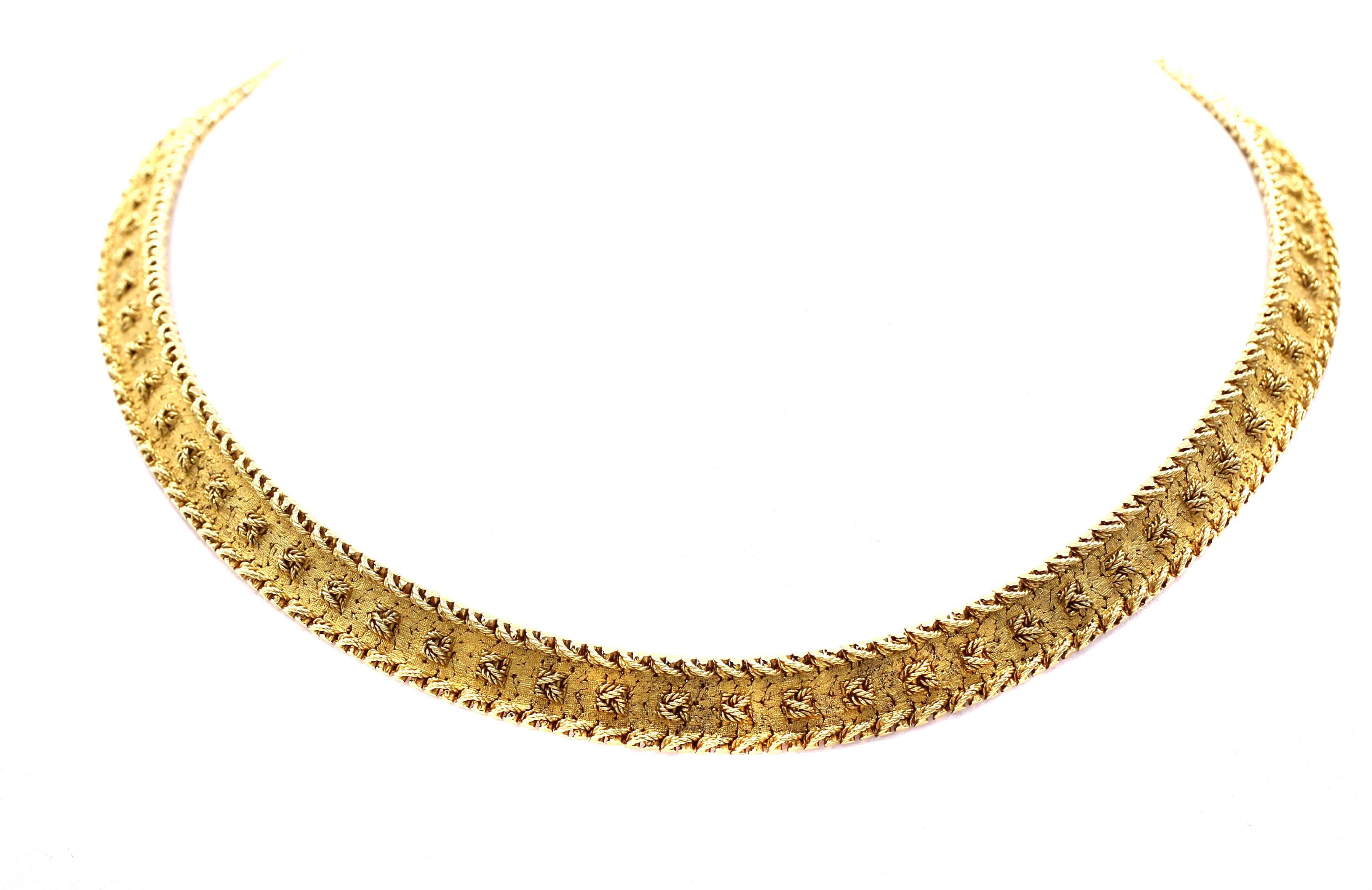 Designed and manufactured by the renown Swiss watch company Patek Philippe, they created a limited line of fine jewelry to accompany their fine watches. Magnificently handcrafted this charming and elegant 18 karat gold necklace intricate textured