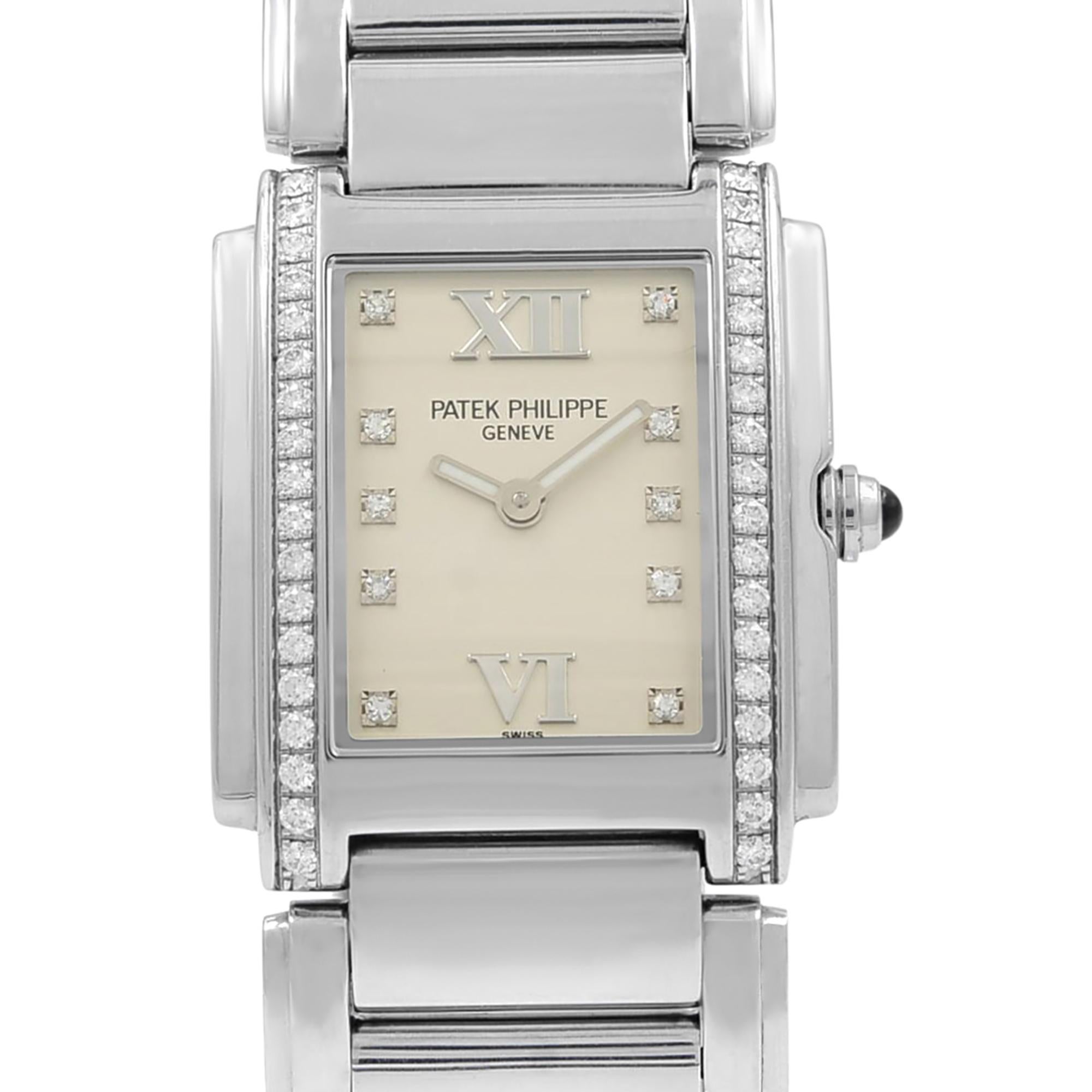 This pre-owned Patek Philippe 24 Diamond 4910-10A-011 is a beautiful ladies timepiece that is powered by a quartz movement which is cased in a stainless steel case. It has a rectangle shape face, no features dial and has hand diamonds style markers.