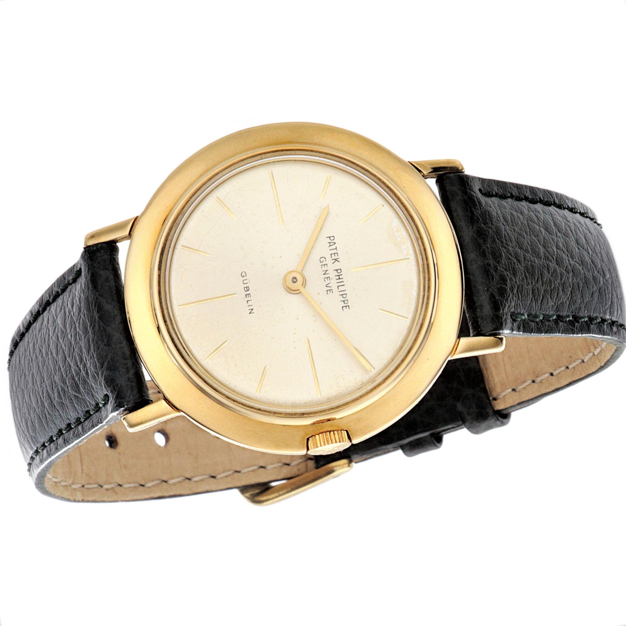 Patek Philippe 2595J Vintage Calatrava, Retailed by Gueblin in Zurich.  The watch is made in 18K Yellow Gold and measures 32mm in diameter, and was made in the late 1950's approximately 1957.  The watch is fitted with a 23-300 caliber movement