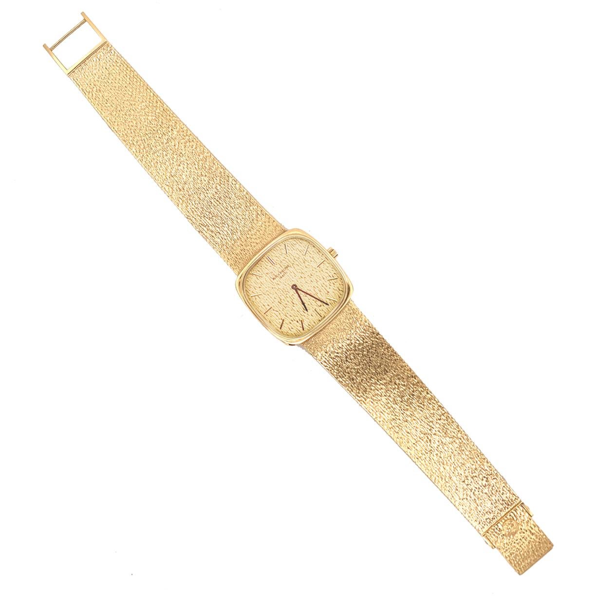 Beautiful wristwatch:  PATEK PHILIPPE slim cushion wristwatch with integral mesh bracelet.  18K textured yellow gold.  Softened edge square case, approximately 28mm x 28mm.  7