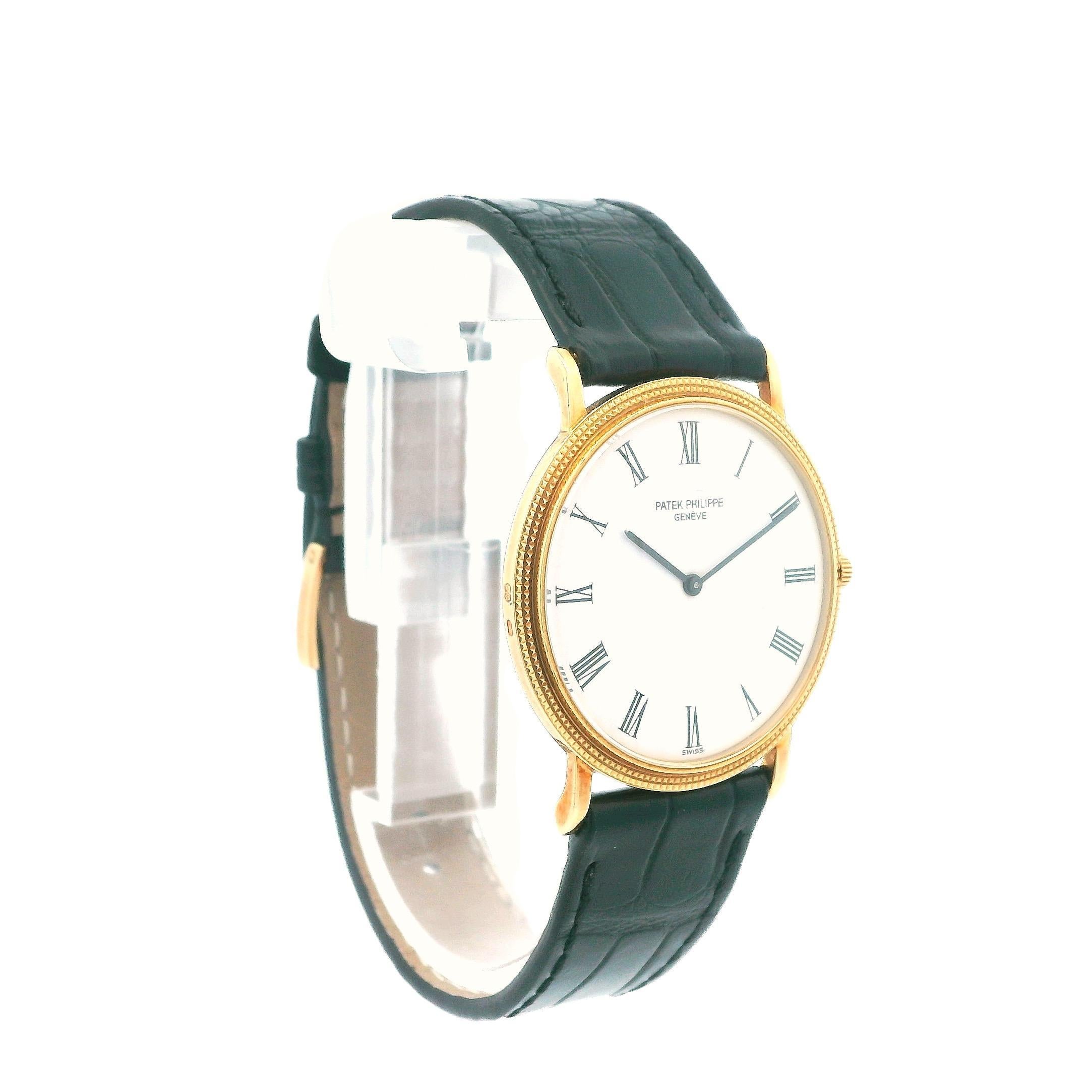 The Patek Philippe 3520D is an elegant timepiece that exemplifies luxury and craftsmanship. It features a 32mm case made of 18K yellow gold, paired with a distinctive hobnail bezel that adds texture and visual interest. The watch has a sophisticated