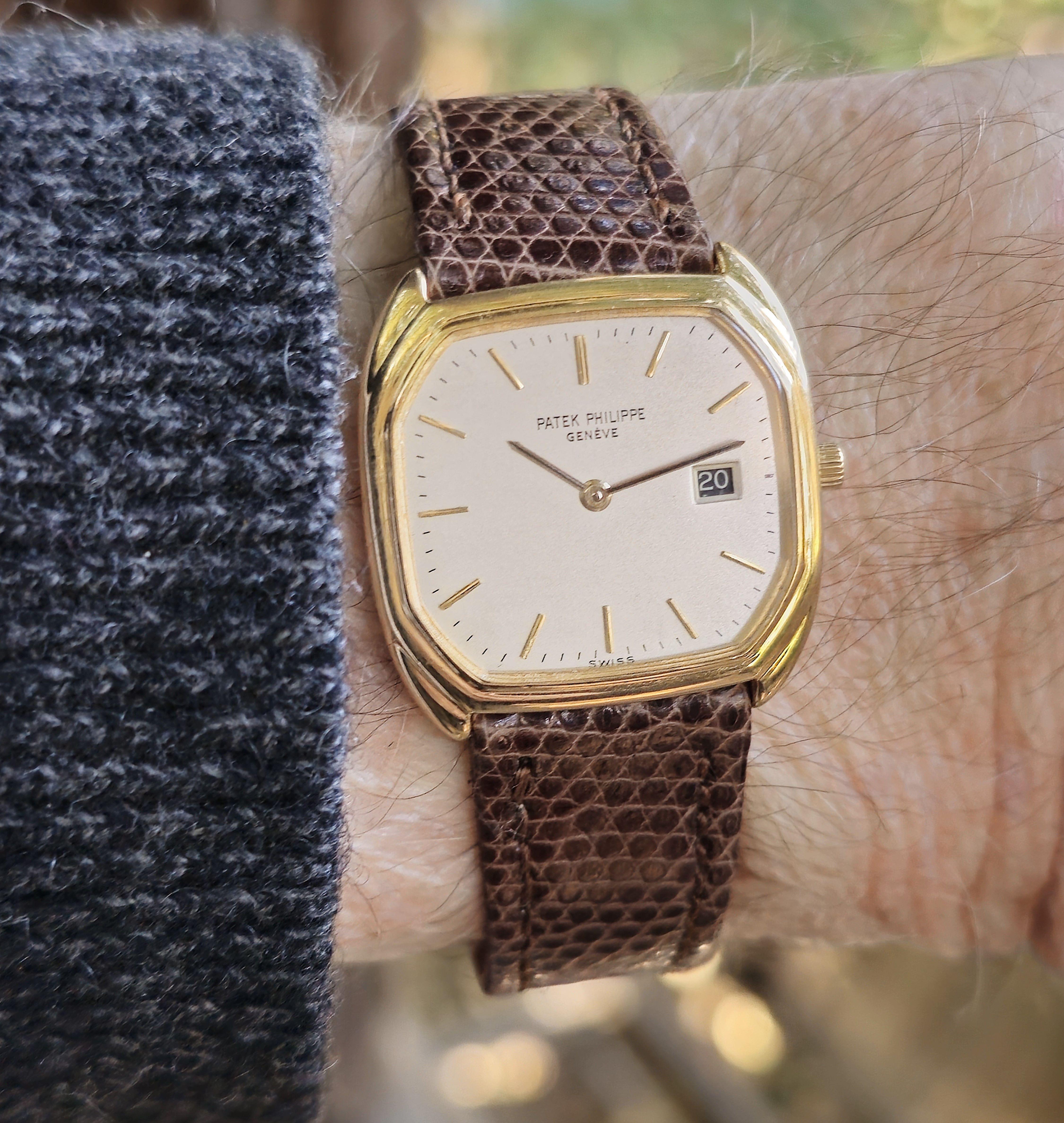Introduction:  Patek Philippe 3761; Mid size Unisex Quartz Cushion watch;  measuring 27 x28 mm with an  E-19 caliber quartz movement #1526801 / 2802027.  This watch is such an understated classic watch, with minimalist style dial.  The case is made