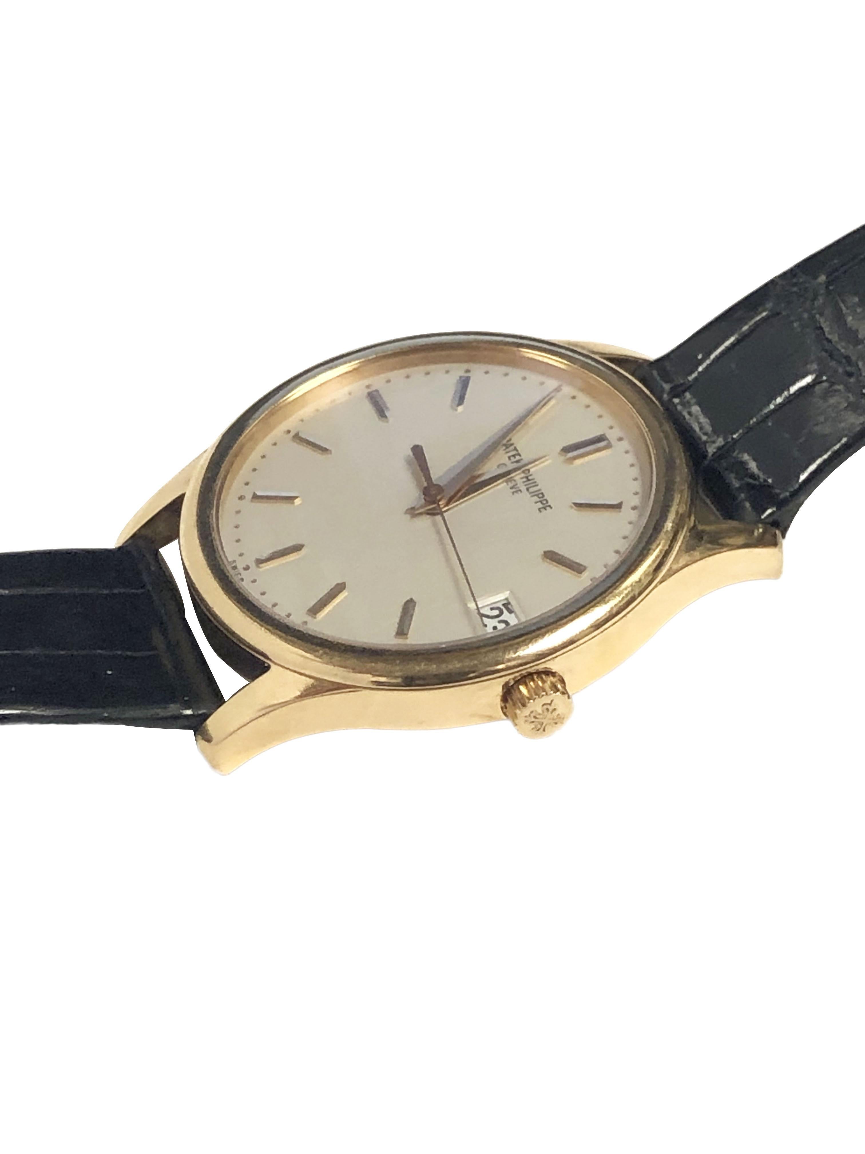 Circa 2000 Patek Philippe Wrist Watch 18k Yellow Gold 34 M.M. 3 piece Water Resistant case, Automatic self-winding movement. Rhodium-plated, fausses cotes decoration, straight-line lever escapement, mono-metallic balance adjusted to heat, cold,