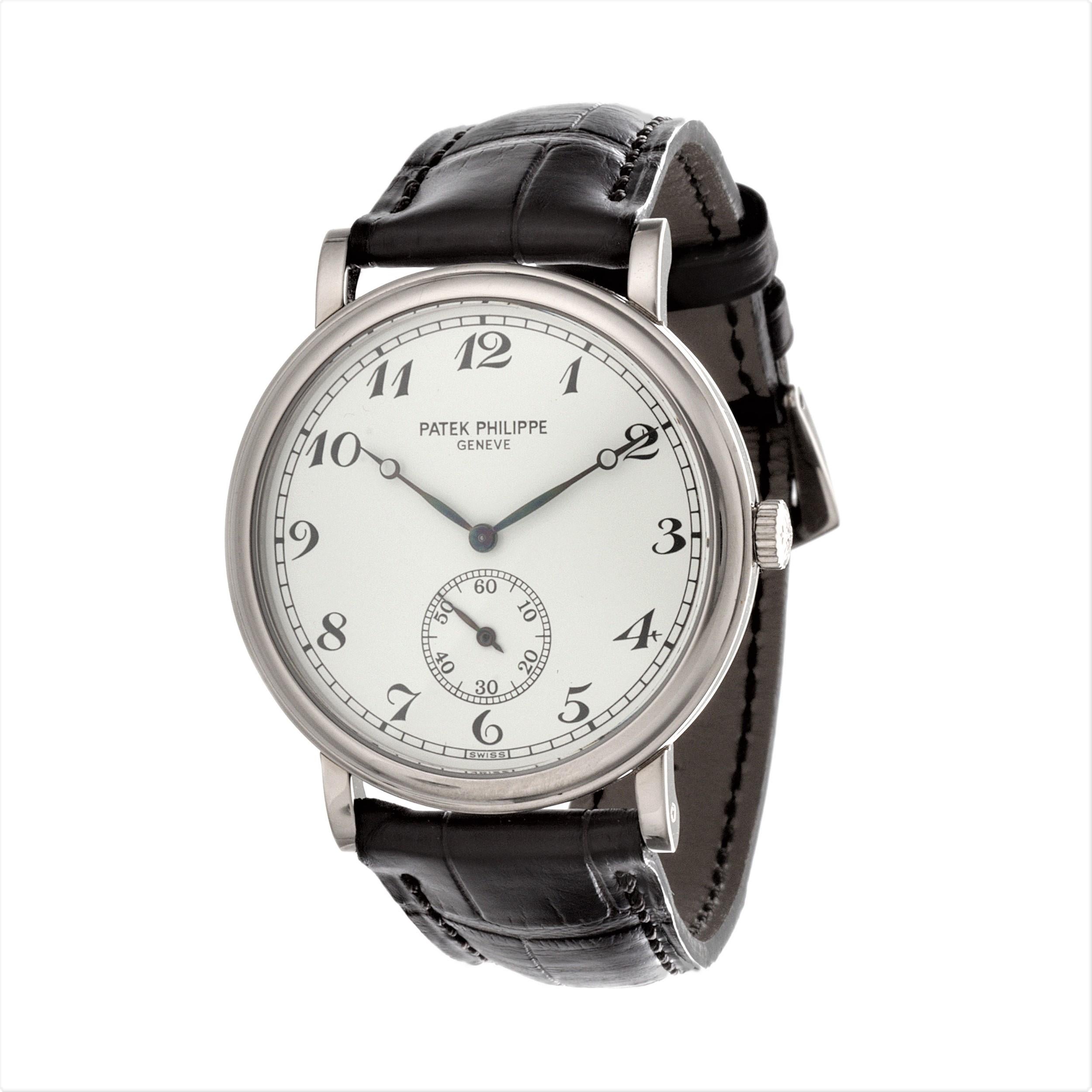 Patek Philippe 5022G-012 Officers Dial Calatrava watch.  The watch measures 33 mm in diameter, and is made in 18 karat White Gold with Brown Patek Philippe alligator strap with its white gold buckle. The watch is fitted with a 215 PS Caliber