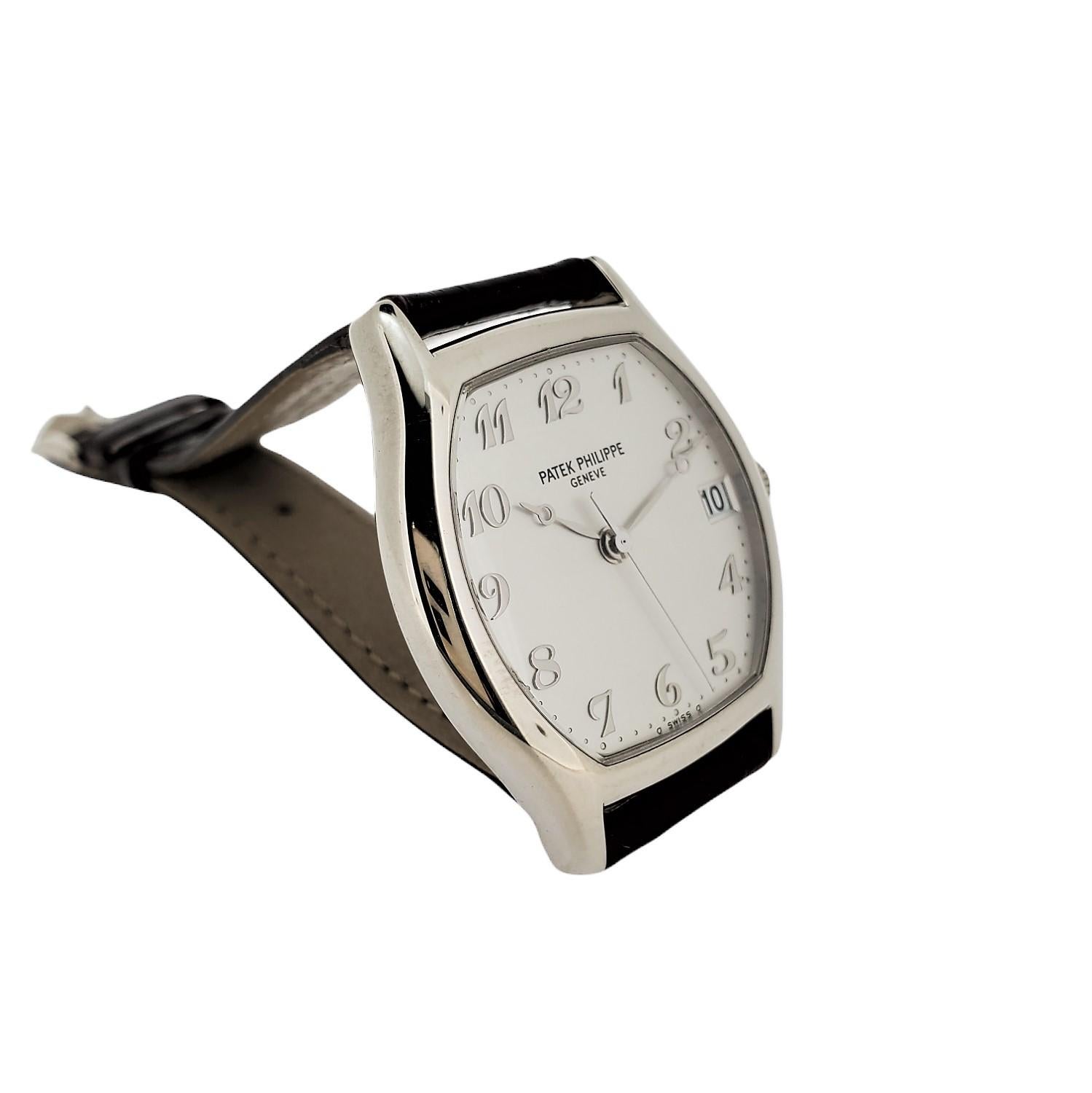 Introduction: 
Patek Philippe 5030G;  Automatic Tonneau shaped watch.  The watch is made in 18K Whte gold and is fitted with an 315 SC caliber movement # 3016886 case# 4116482.  The watch appears not to have been worn much,  or polished and is in