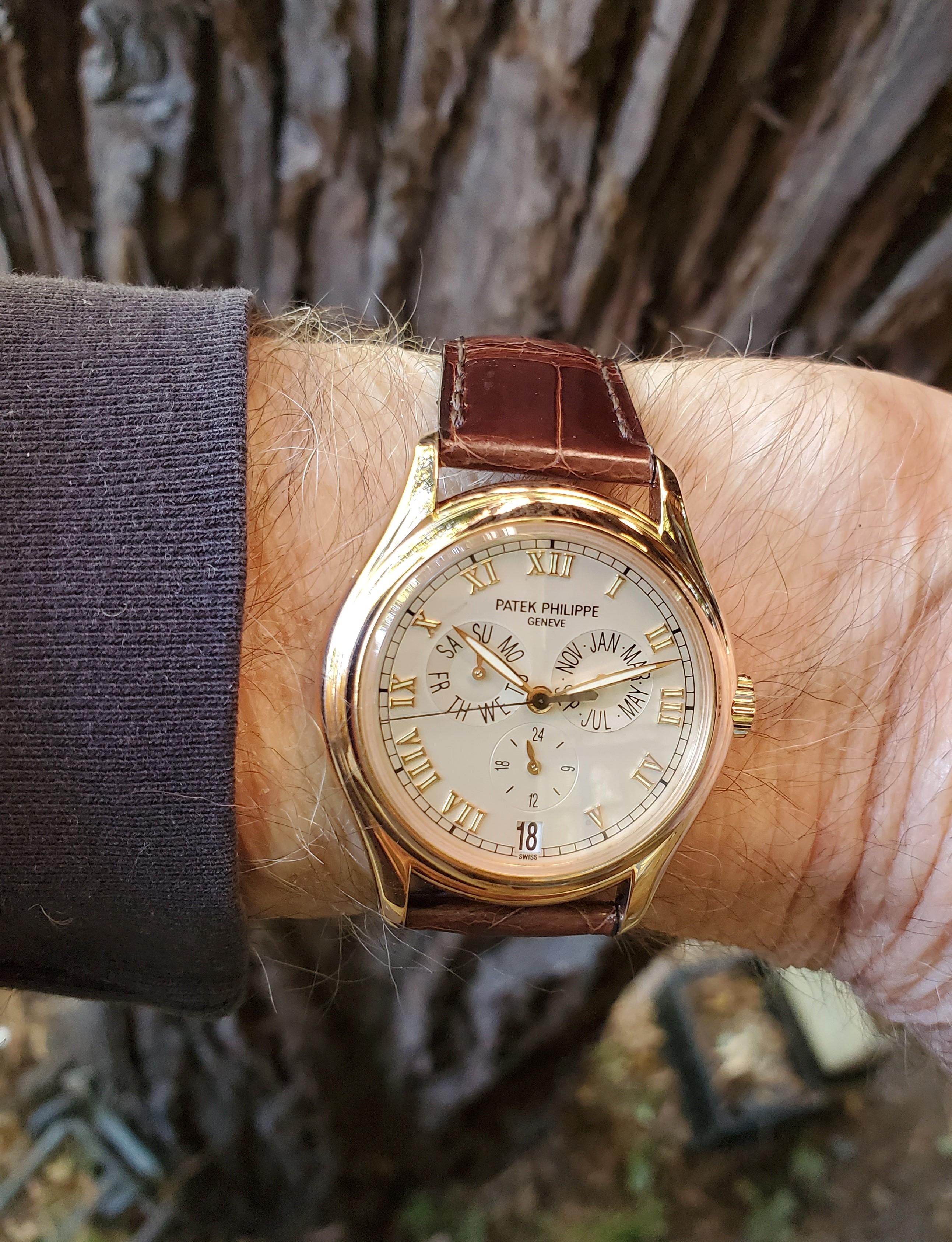 Patek Philippe 5035R Complicated Annual Calendar.  The watch is made in 18K rose gold with a 24 hour indication, Day, Date, Month, Circa 2000.  The Dial is silvered white, with raised rose gold Roman numerals, radium hand, The watch is fitted with 