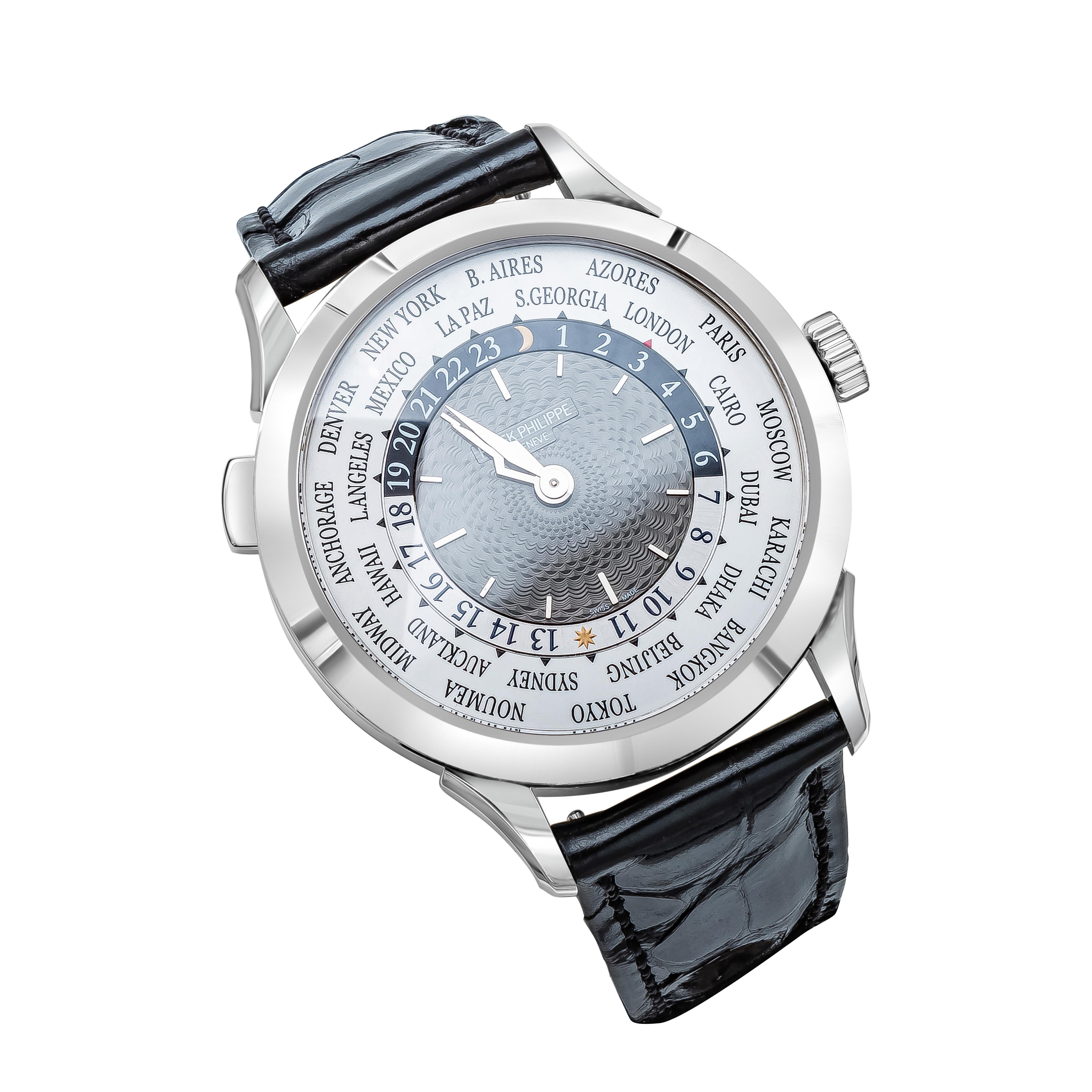 Patek Philippe Model 5230G World Time Complications. Manufactured in 2021.
18k White Gold, 39 millimeter case with sapphire crystal glass and case back.
Patek Philippe 240 HU movement with 33 jewels.
Grey guilloche dial with concentric chapter ring