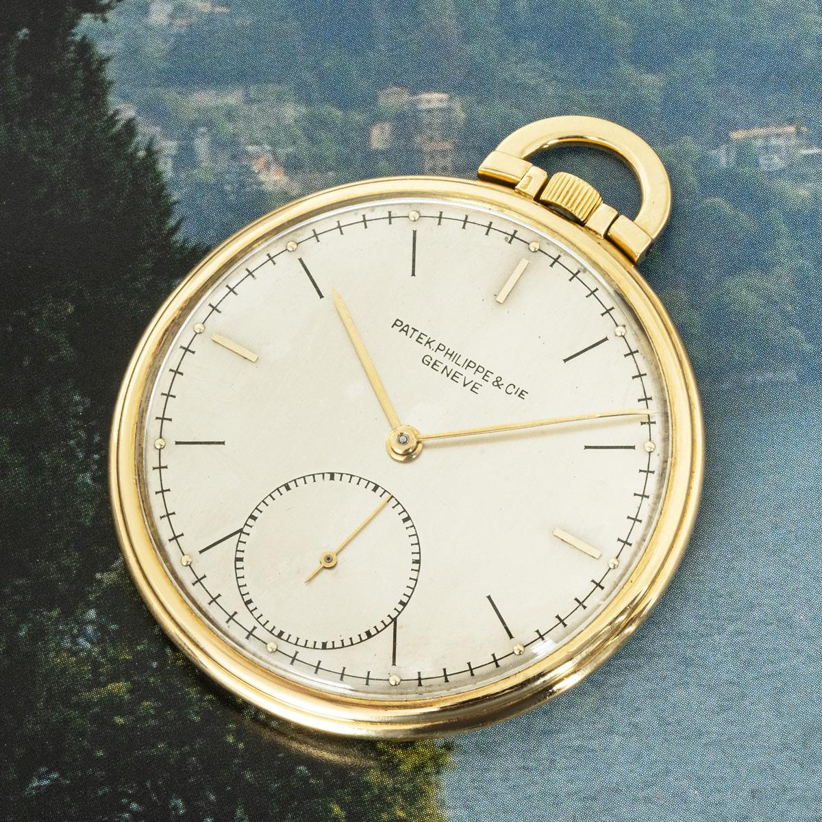 Patek Philippe. An 18ct Yellow Gold Slim Keyless Lever Open Face Pocket Watch C1944

Dial: The Silver dial fully signed Patek Philippe & Cie Geneve with batons, outer minute track and subsidiary seconds dial at six o'clock. The original slim elegant