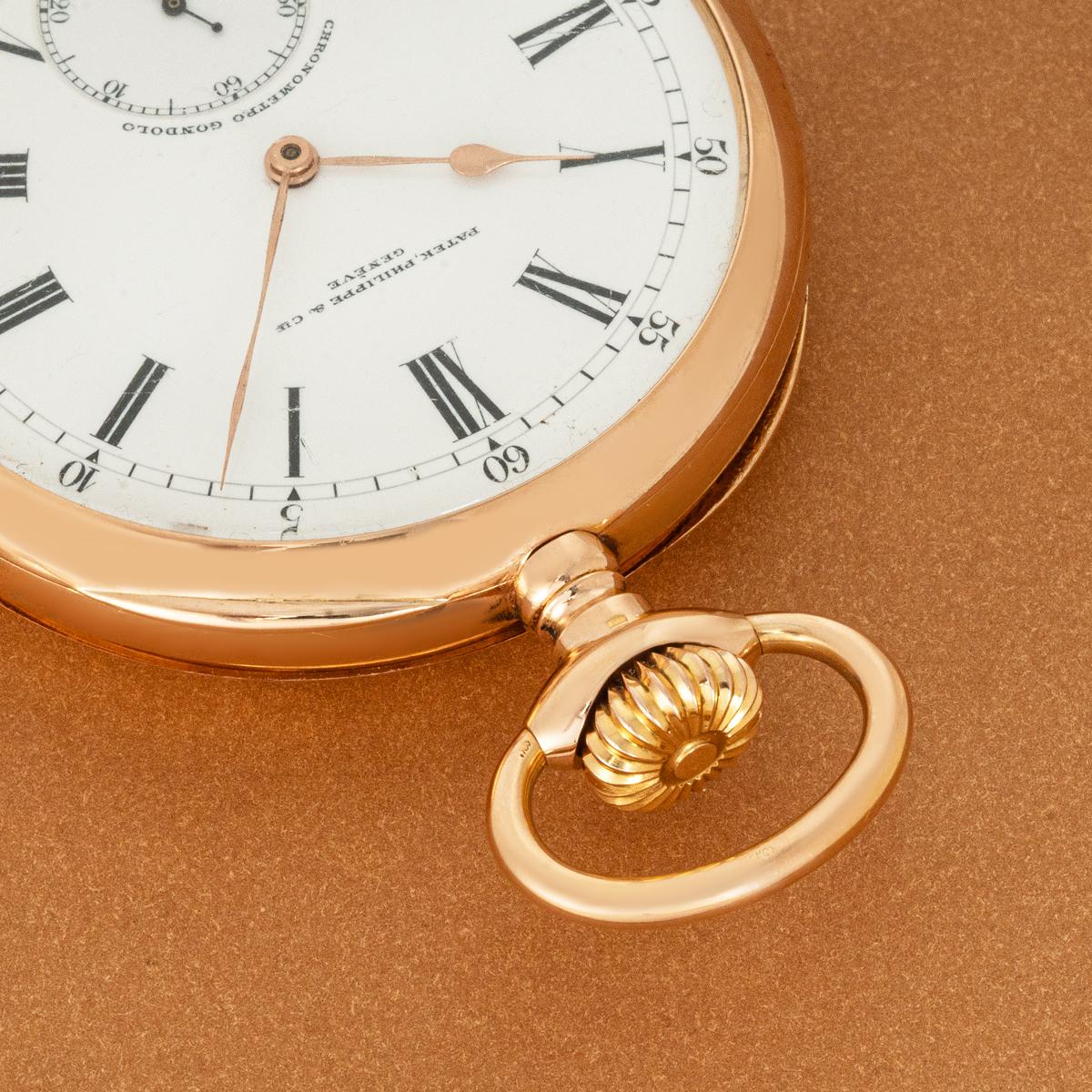 A Patek Philippe 18ct Rose Gold, Keyless Lever Gondolo Open Face Pocket Watch, C1900s.

Dial: A perfect white enamel dial with Roman numerals, outer minute track with Arabic five min intervals signed Patek Philippe & Co Genève with sub second dial