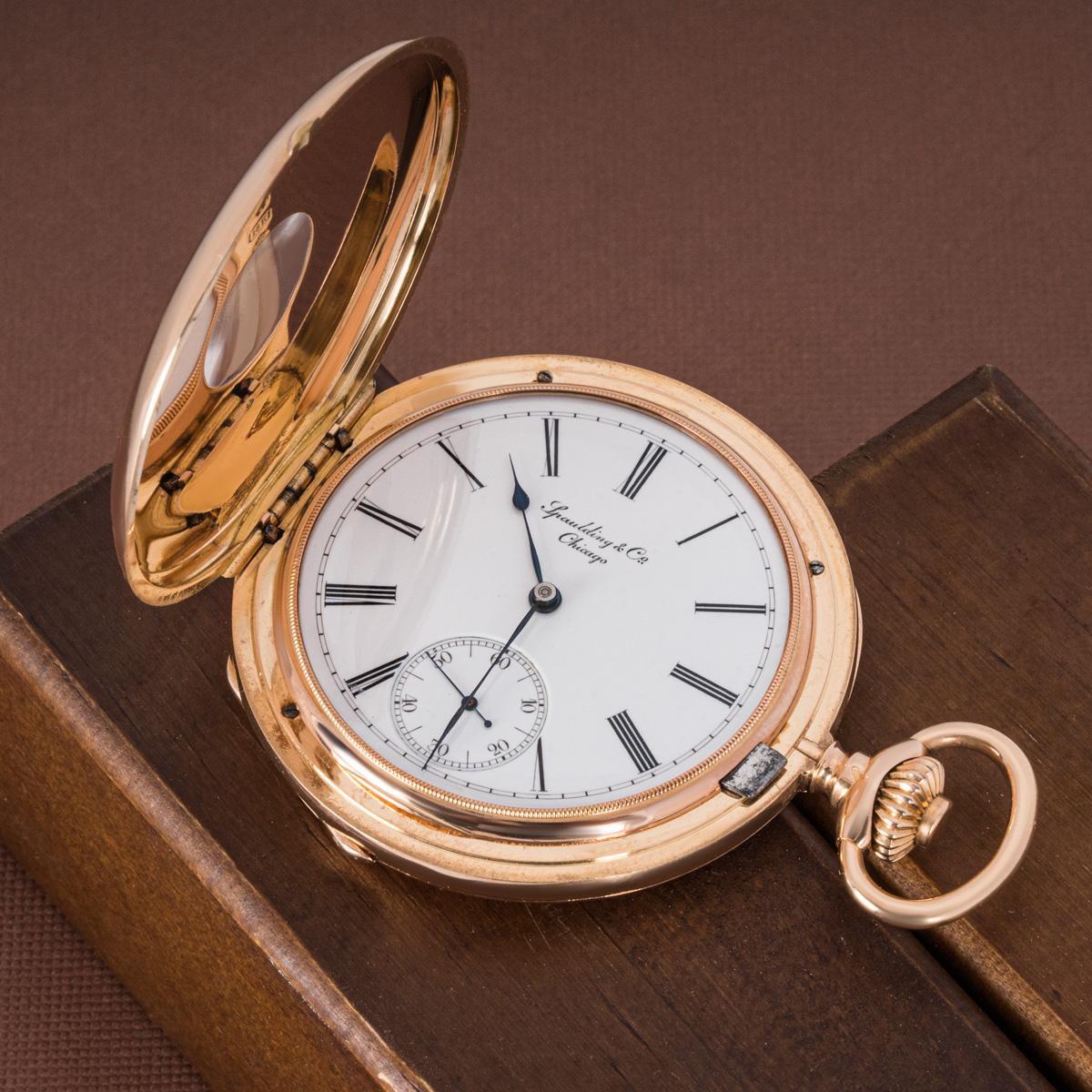 Patek Philippe.An 18ct Rose Gold Double Name Spaulding & Co Half Hunter Keyless Lever Pocket Watch C1888.

Dial: The crisp white enamel Roman dial with outer minute track and subsidiary dial at six o' clock, signed Spaulding & Co Chicago. The