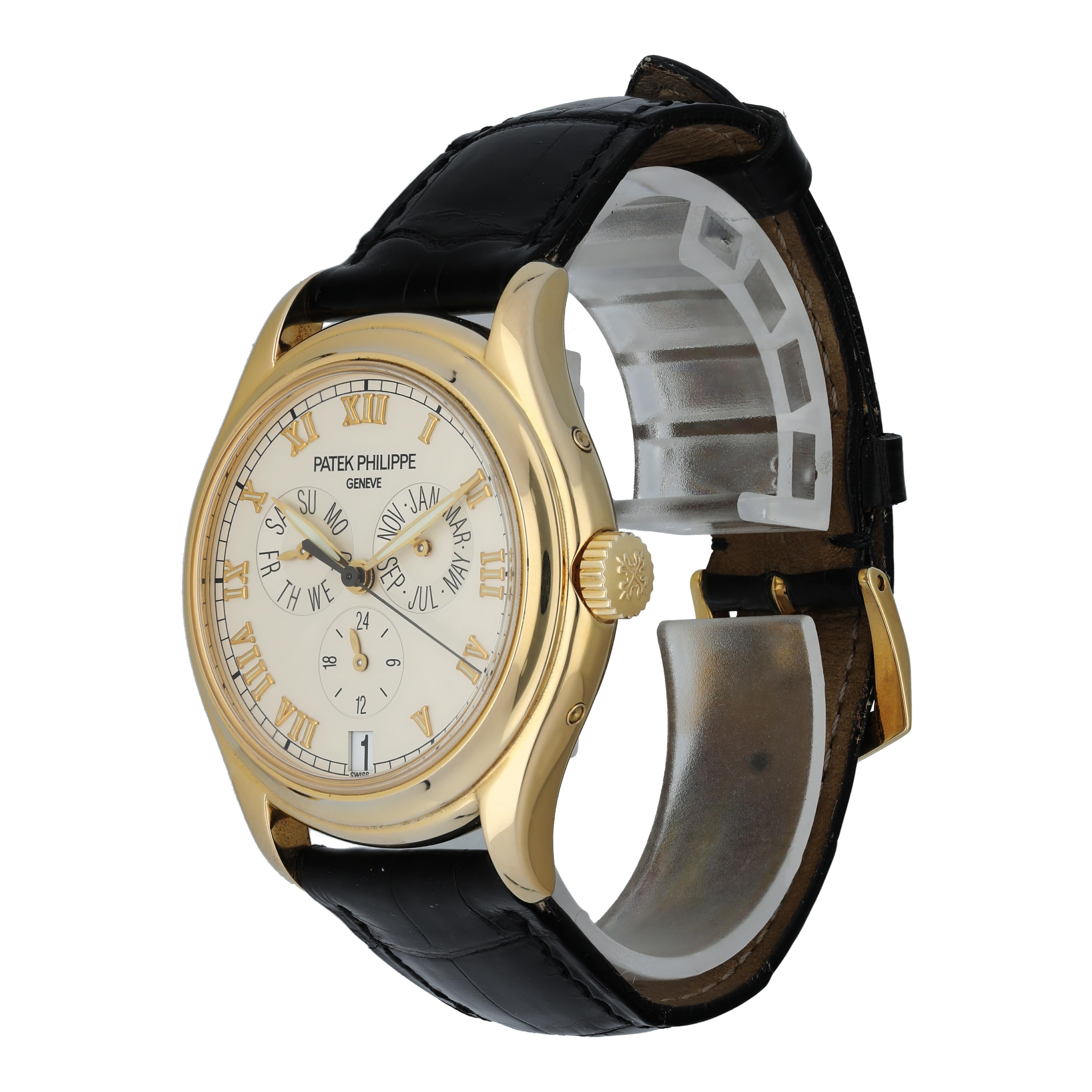 Patek Philippe Annual Calendar 5035 Men's Watch.
37mm 18k Yellow gold case. 
Yellow Gold Stationary bezel. 
Off-White dial with gold hands and Roman numeral hour markers. 
Minute markers on the outer dial. 
Date display at the 6 o'clock position.