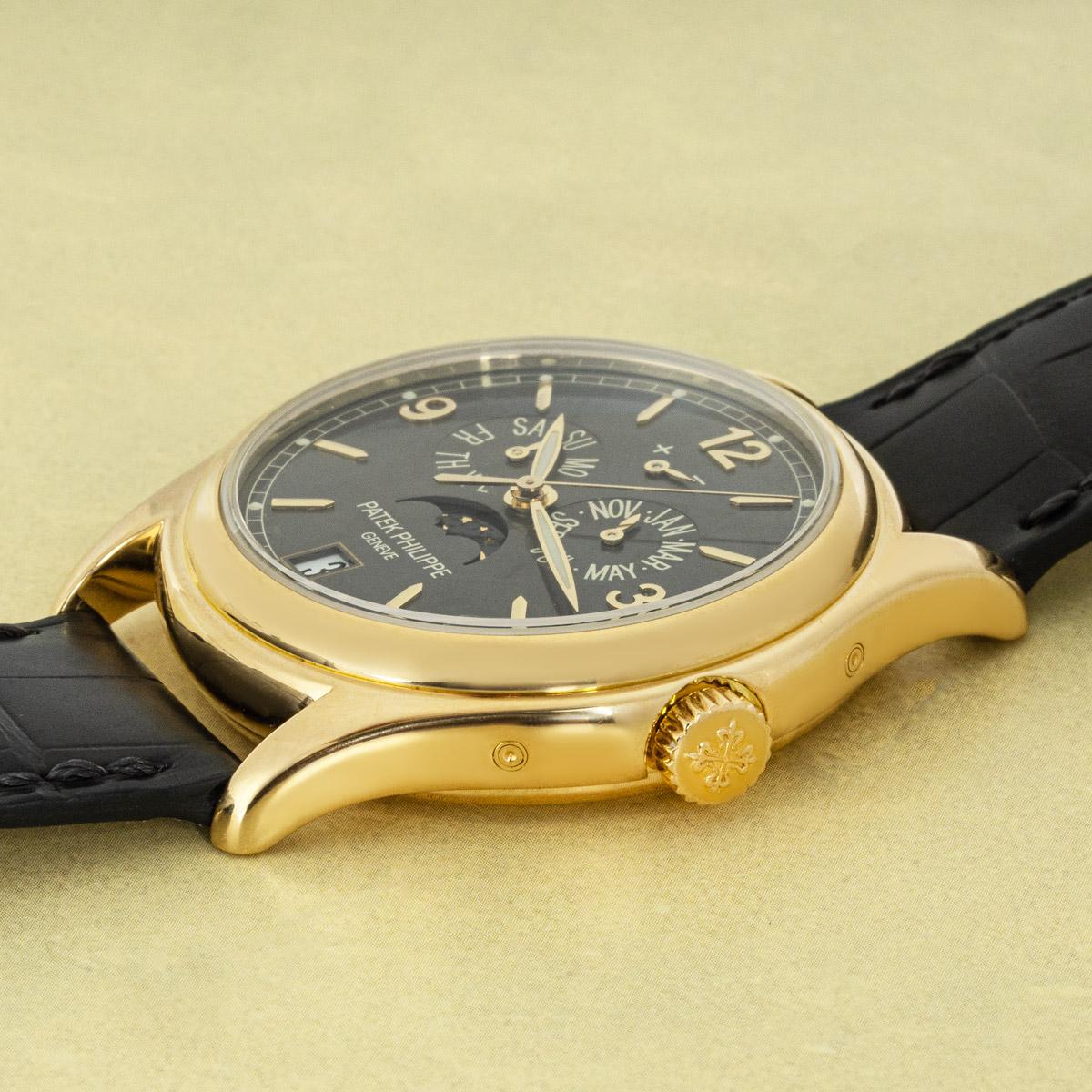 A 39mm Patek Philippe Annual Calendar in yellow gold. Featuring a grey dial with displays of the day, date and month. The dial also features a moon phase display and power reserve indicator encased by a yellow gold bezel.

Fitted with sapphire glass