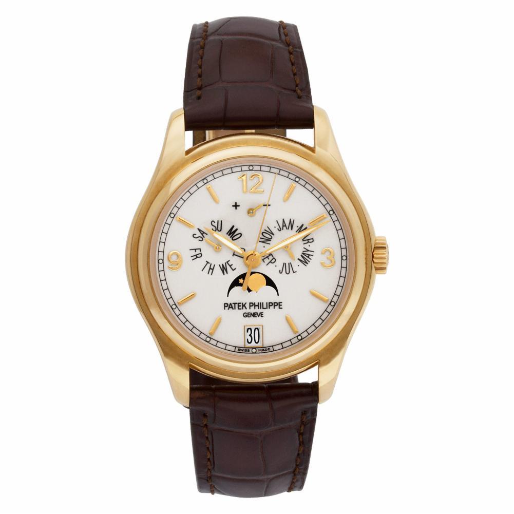 Patek Philippe Annual Calendar Reference #:5146J-001. Patek Philippe Annual Calendar in 18k gold on leather strap with 18k PP deployant buckle. Auto w/ sweep seconds, date, day, month, power reserve, and moonphase. With archive papers, box and