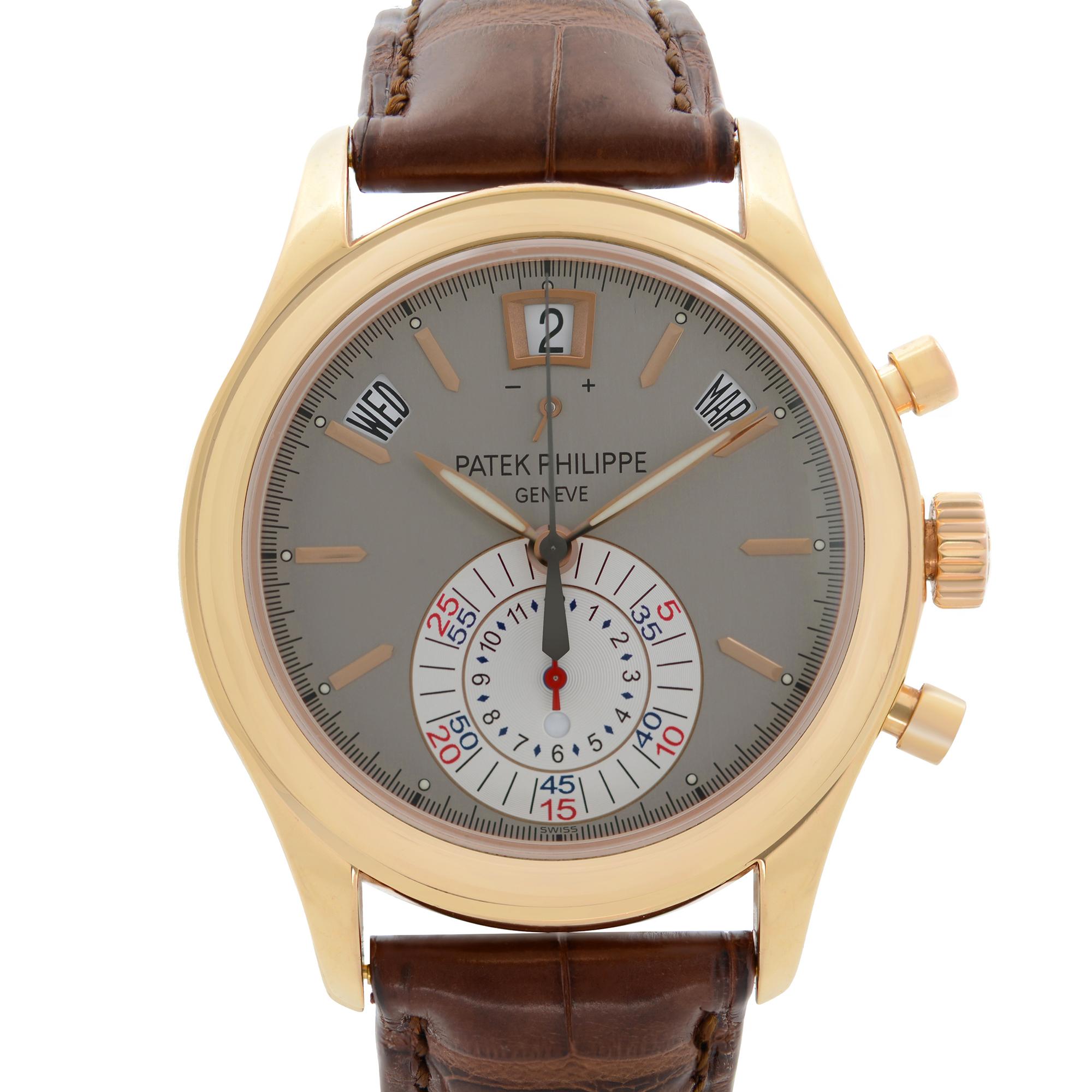 Pre-owned Patek Philippe Calatrava 18K Rose Gold Gray Dial Automatic Men's Watch 5960R-001.  Power reserve Indicator, Annual calendar, Deployant Buckle.  This Beautiful Timepiece Features: 18k Rose Gold Case With a Brown Leather Strap, Fixed 18k