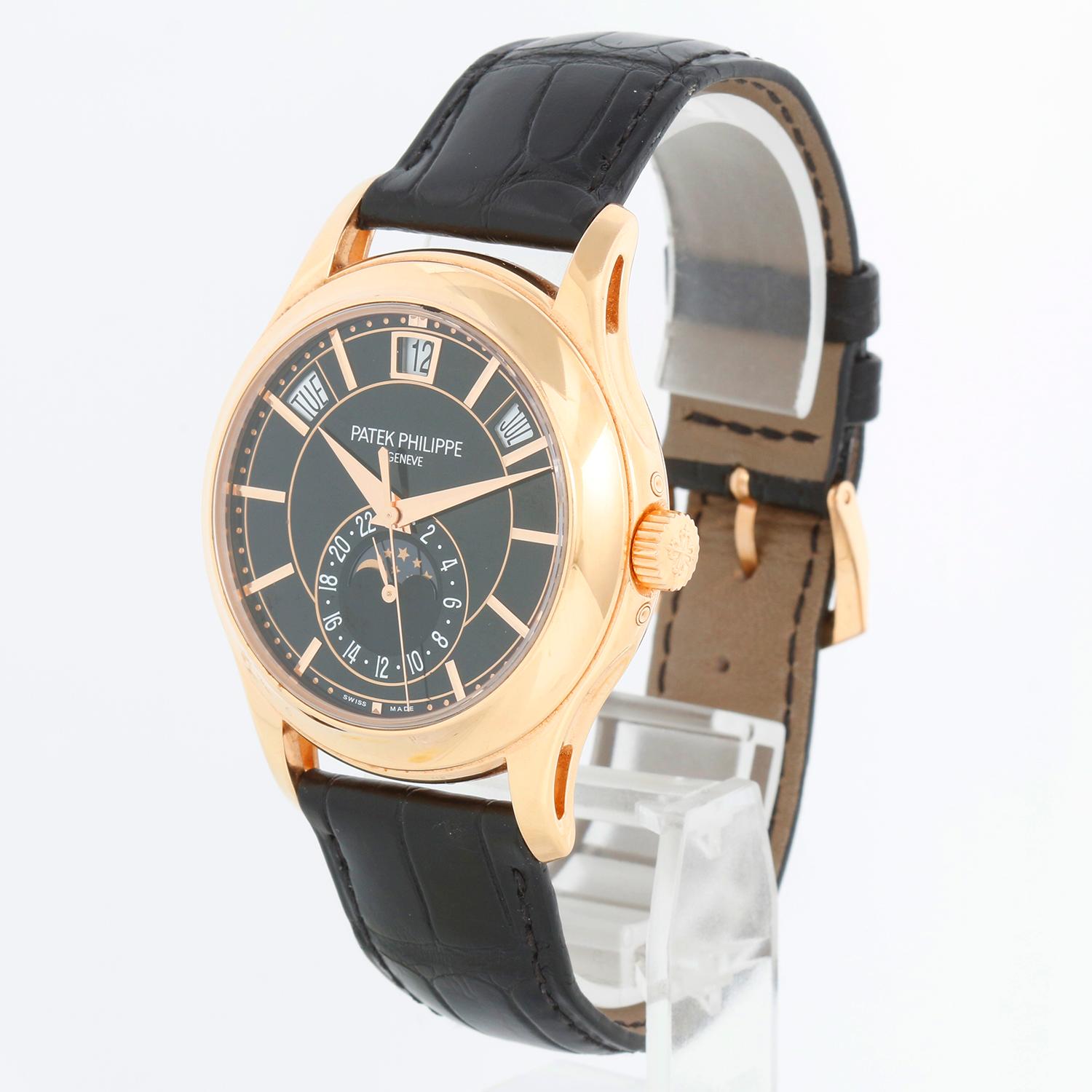 Patek Philippe Annual Calendar Men's 18k Rose Gold Moonphase Watch 5205 R-010 - Calibre: 324 S QA LU 24H, Automatic winding. 18k rose gold case with exposition back (40mm diameter). Black dial with Day, date, month, moonphase and 2nd time zone.