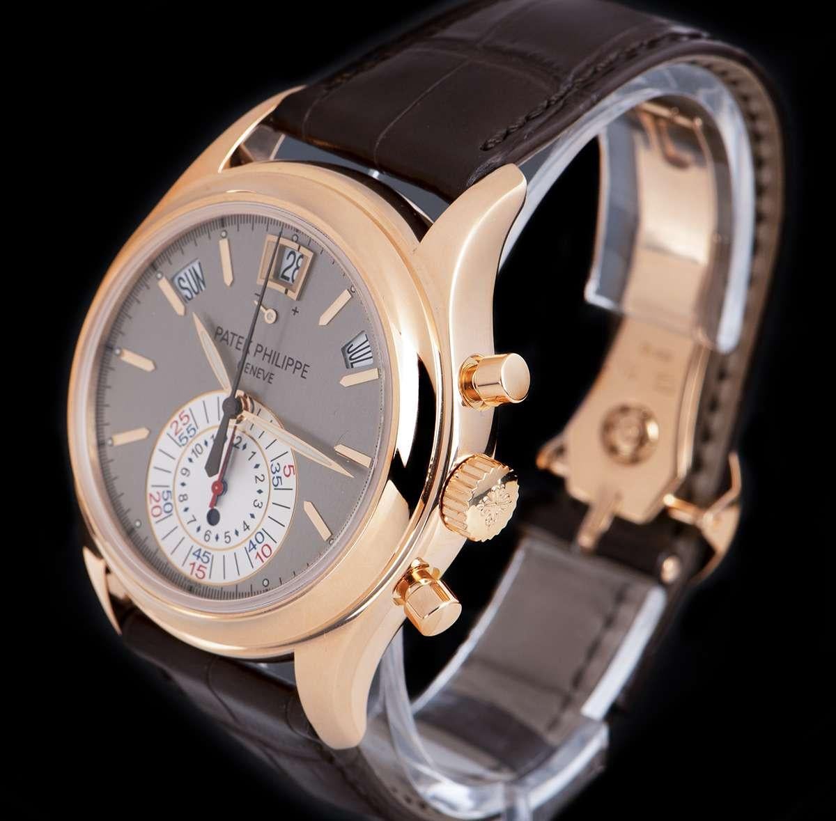 An 18k Rose Gold Annual Calendar Gents Wristwatch, grey dial with applied hour markers, month aperture between 1 and 2 0'clock, 60 minute and 12 hour mono counter at 6 0'clock, day aperture between 10 and 11 0'clock, date aperture and power reserve