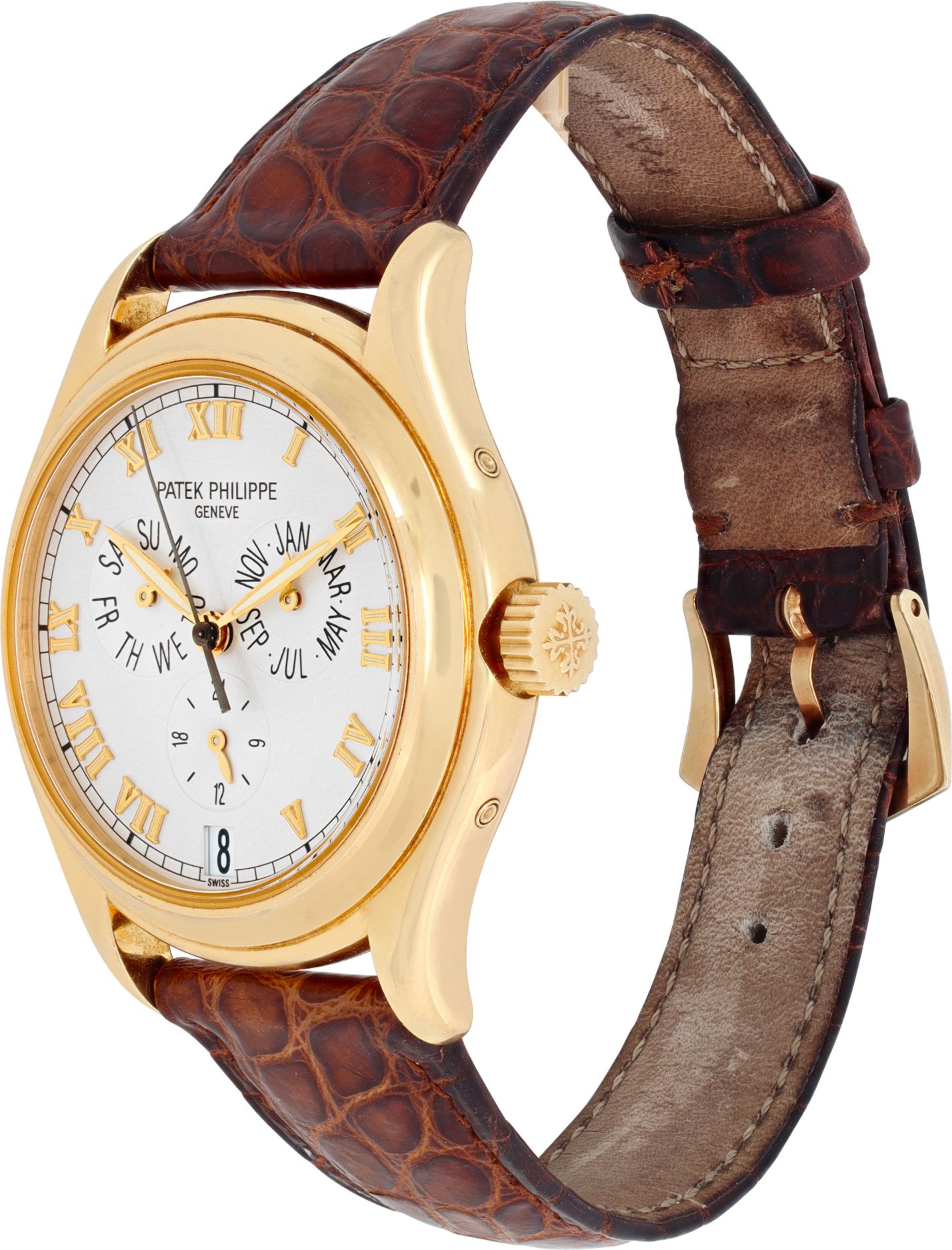 Patek Philippe Annual Calendar in 18k yellow gold on a original Patek Philippe brown alligator strap with PP 18k tang buckle.Caliber 315/198. 35 jewels. Auto w/ annual calander 37 mm case size. Box and open papers. Ref 5035j-001. **Bank wire only at