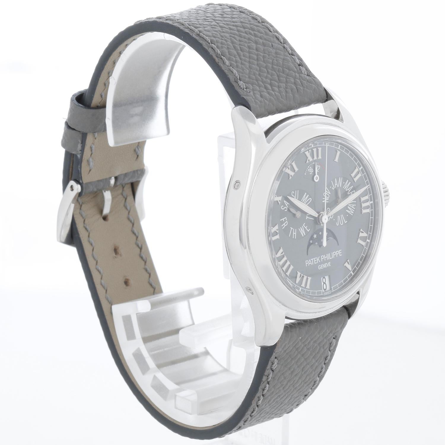 Patek Philippe Annual Men's Platinum Automatic Moonphase Watch 5056P (or 5056-P) - Automatic winding; annual calendar with day, date, month & moonphase; power reserve indicator. Platinum  case with exposition back and diamond mounted between the