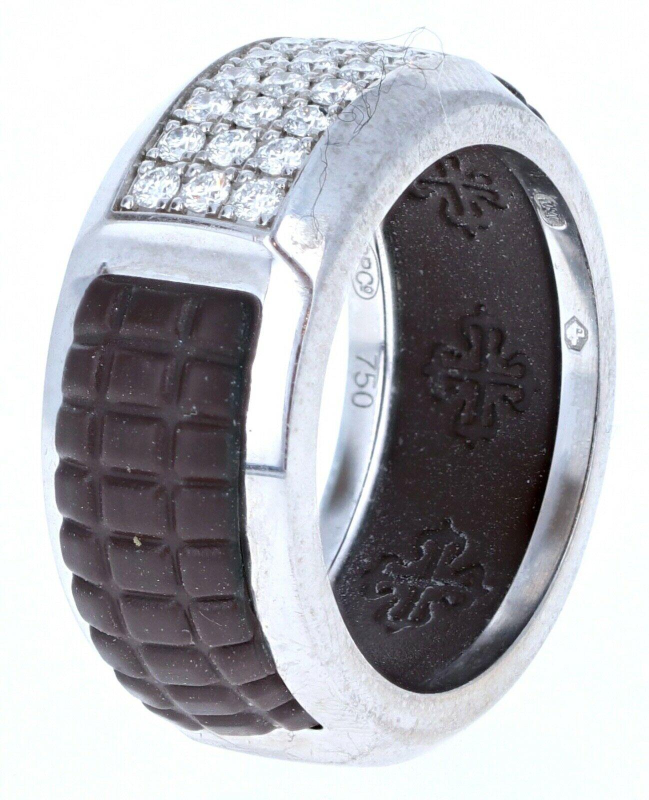 Patek Philippe 18k White Gold, Rubber & Diamond Band Ring 8.8g Sz 6.5

For sale is a Patek Philippe 18k white gold, rubber and diamond band. 
The ring is super chic worn on any ringer.
 The ring is 9.2mm wide and is a size 6.5
 Good condition. Get