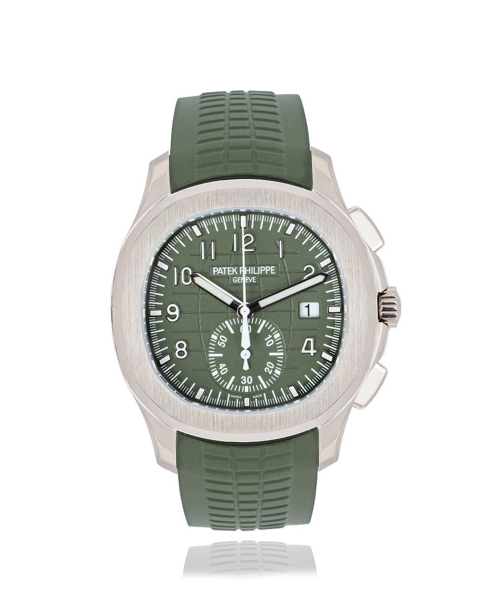 An unworn 42.2mm Aquanaut Chronograph in white gold by Patek Philippe. The khaki green dial embossed with the Aquanaut pattern features a date display and a 60 minute counter, it's covered by sapphire crystal. Complemented by the matching composite