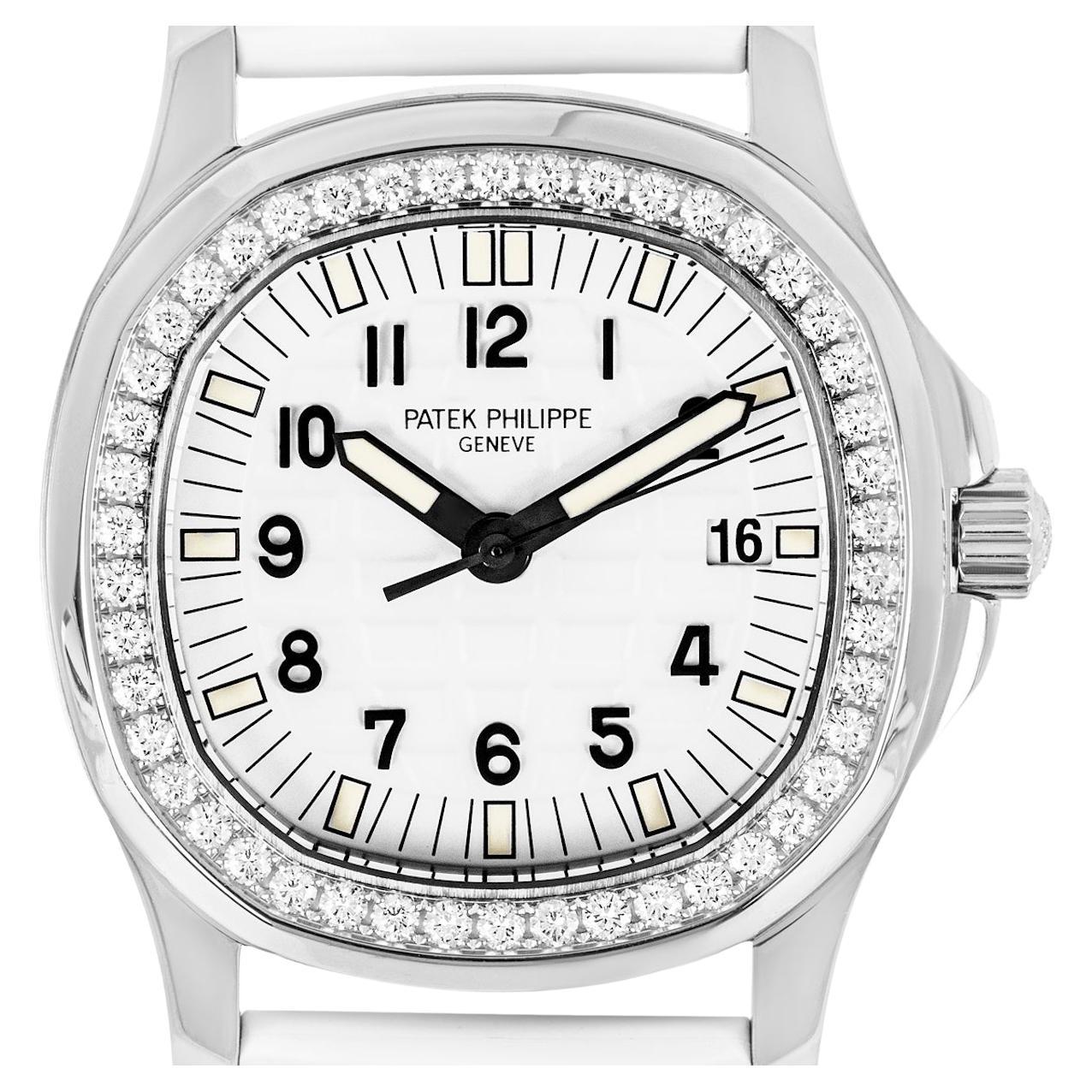 A ladies 35mm Patek Philippe Aquanaut in stainless steel. Features a white embossed dial with applied arabic numbers, a date aperture and a fixed stainless steel bezel set with 46 round brilliant cut diamonds.

Fitted with a scratch-resistant