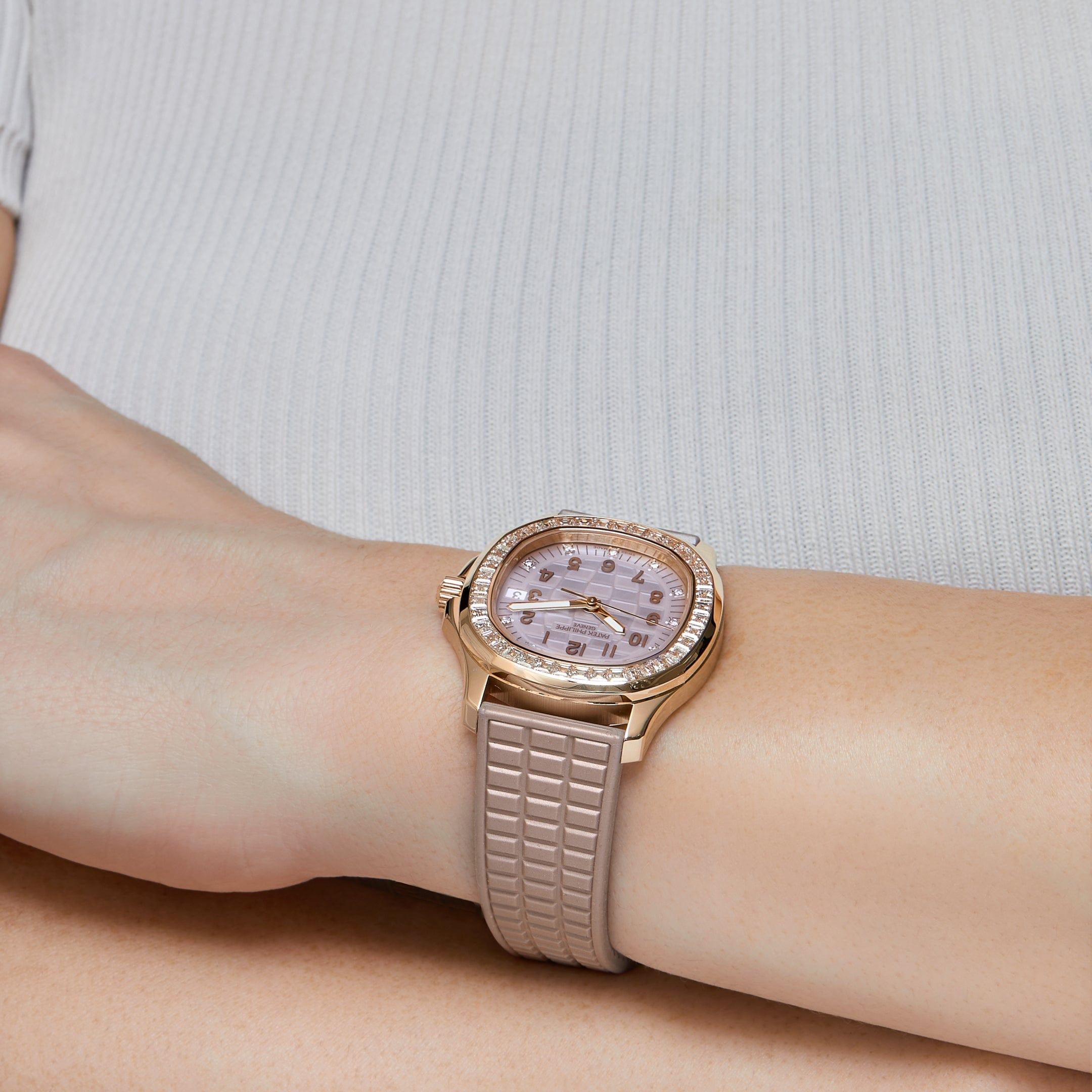 Jewels Aficionado offers this Patek Philippe Aquanaut Luce 5072R-001 ' Haute Joaillerie' is designed in a 35.6mm 18K rose gold case, decked out in diamonds, and styled on a beige rubber strap. The Mother Of Pearl dial is surrounded by a 40