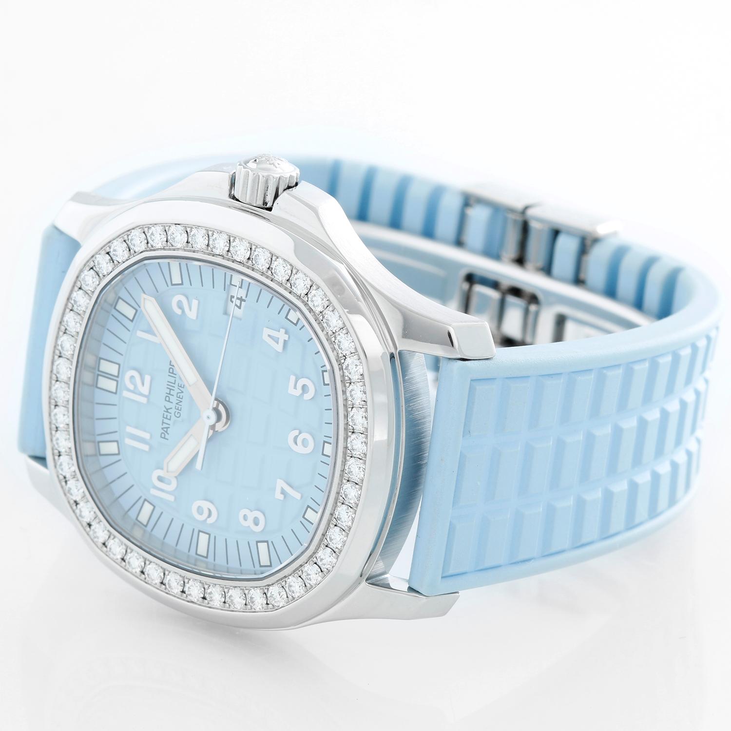 Patek Philippe Aquanaut Luce Ladies Stainless Steel Diamond White Watch 5067 - Quartz. Stainless steel case with diamond bezel (34mm diameter). Baby blue waffle dial with white Arabic numerals. Baby blue rubber strap band with stainless steel Patek
