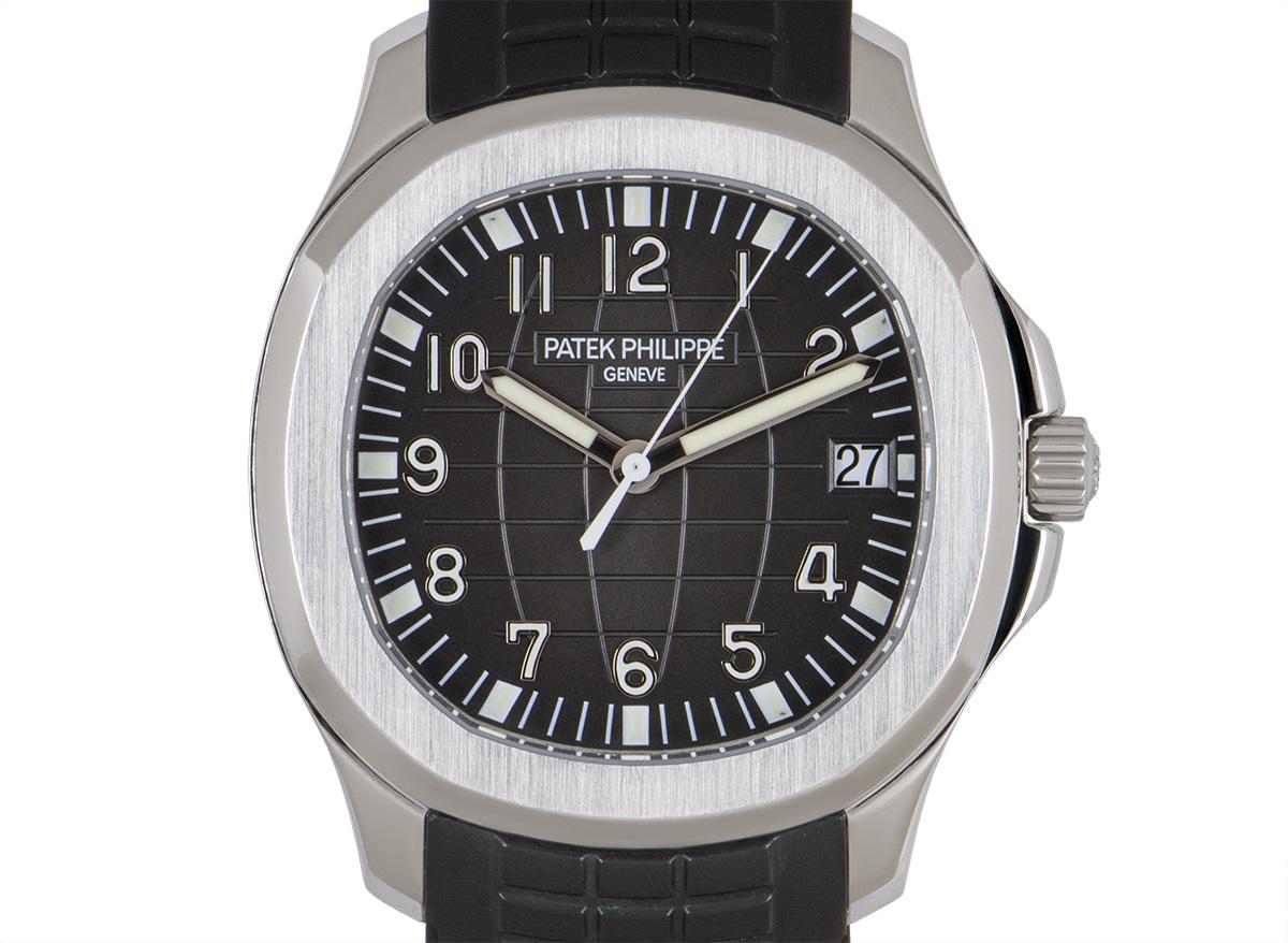 A 40.8 mm stainless steel Aquanaut from Patek Philippe. Its black embossed dial concealed by sapphire crystal features the date. The rounded octagon case was inspired by the Nautilus. An original 