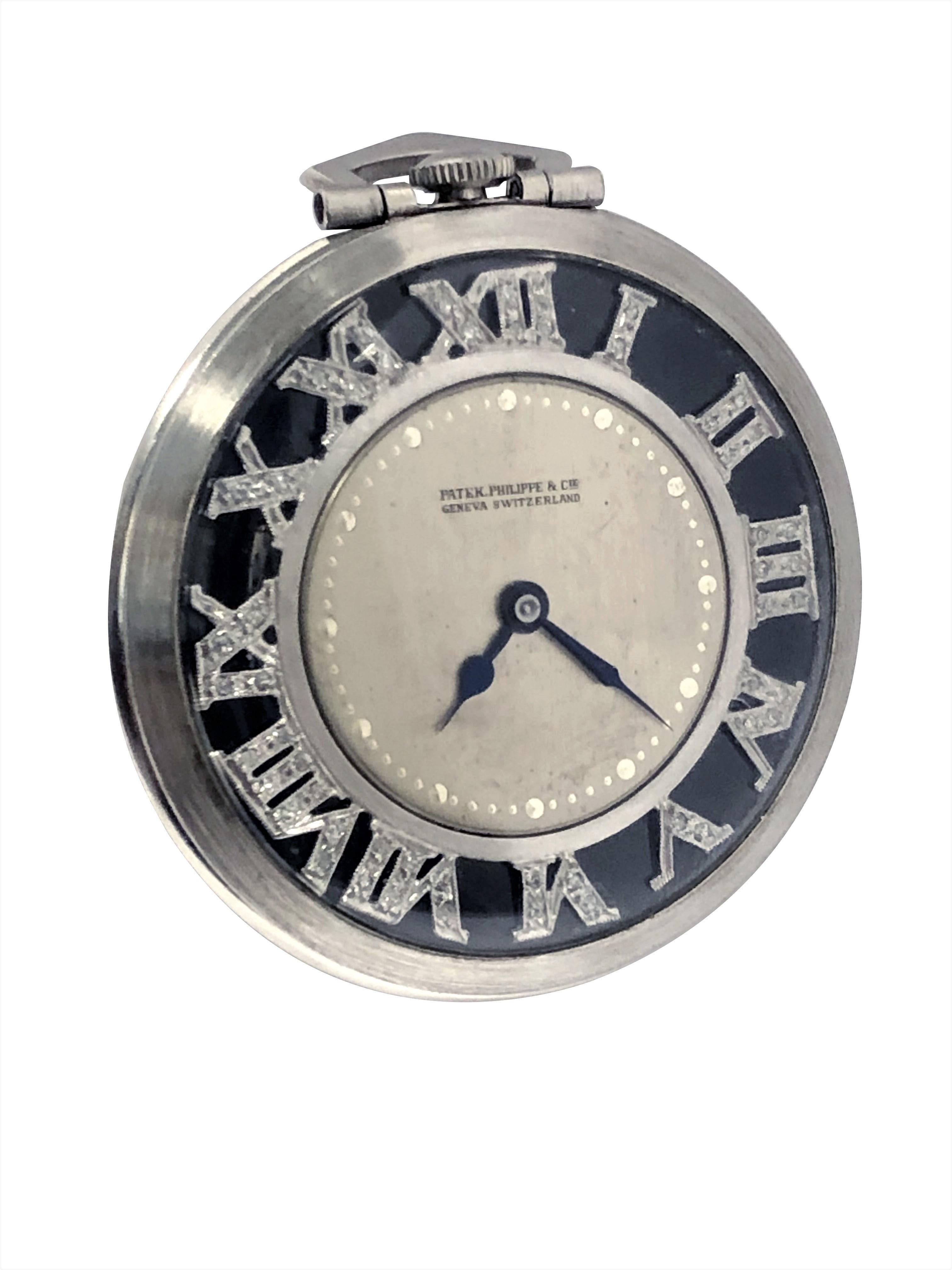 Circa 1930s Art Deco Patek Philippe Pocket watch, 41 M.M. 3 piece Platinum Case, 18 Jewel mechanical, manual wind Nickle Lever movement. Silver Satin dial with Diamond set Roman Numerals set on top of a background of Onyx.  This Particular watch was