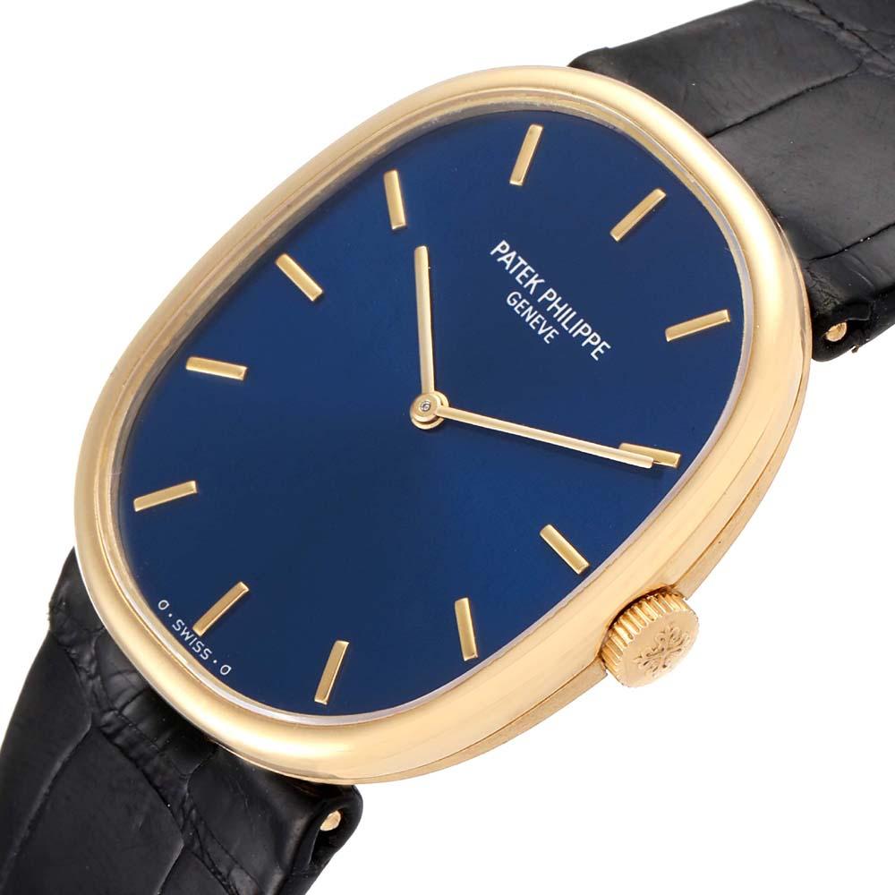 This sophisticated Patek Philippe Golden Ellipse wristwatch is an excellent option for the minimalist, modern man. The watch brings together a blue sunburst dial with raised gold baton hour markers and baton hands. Accented with an 18k yellow gold