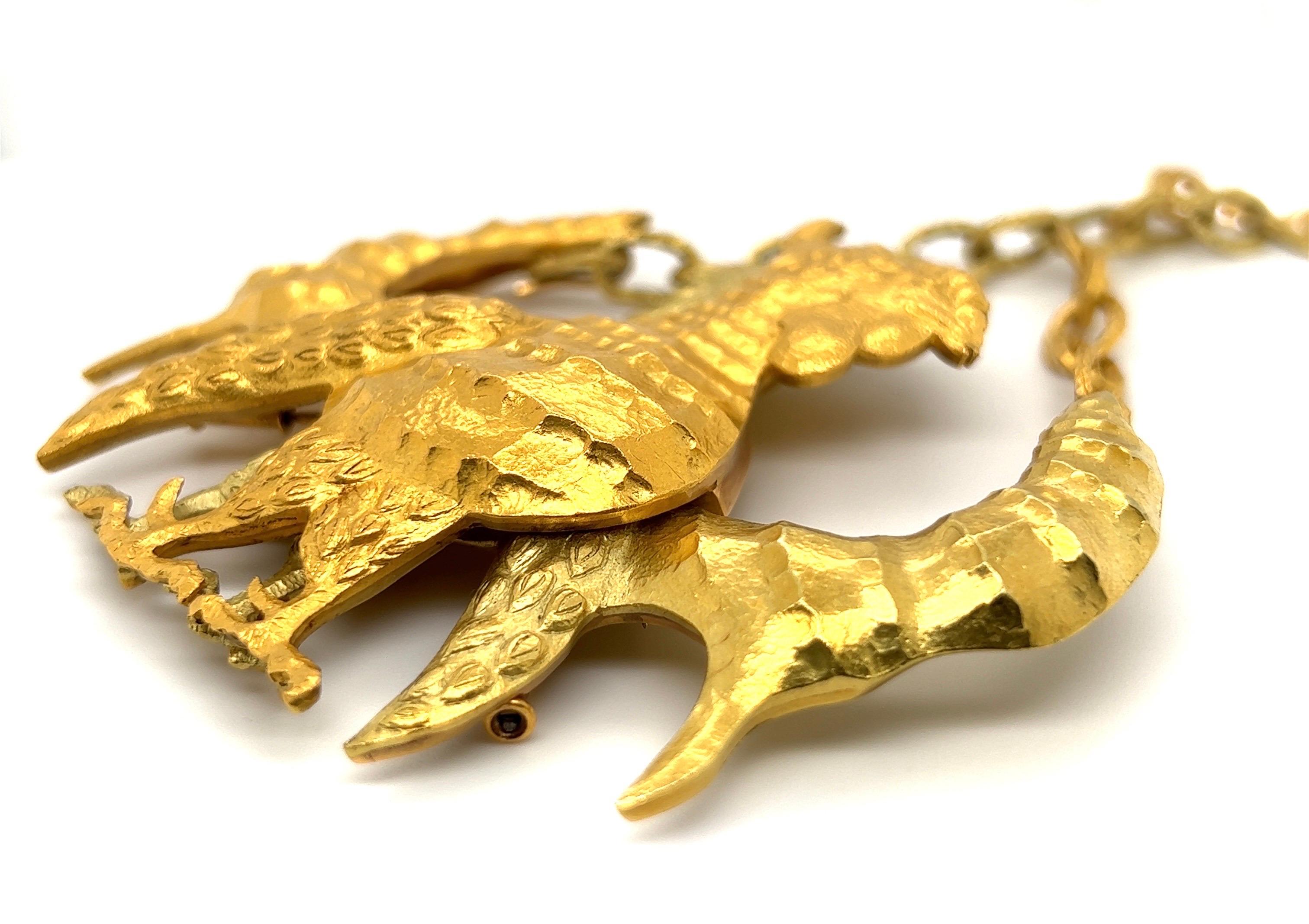 Very rare 18 karat gold double rooster necklace/brooch by French artist Jean Lurçat for Patek Philippe, circa 1960s.

Masterfully handcrafted in 18 karat yellow and greenish-yellow gold and designed as two superimposed feathered mythical creatures.
